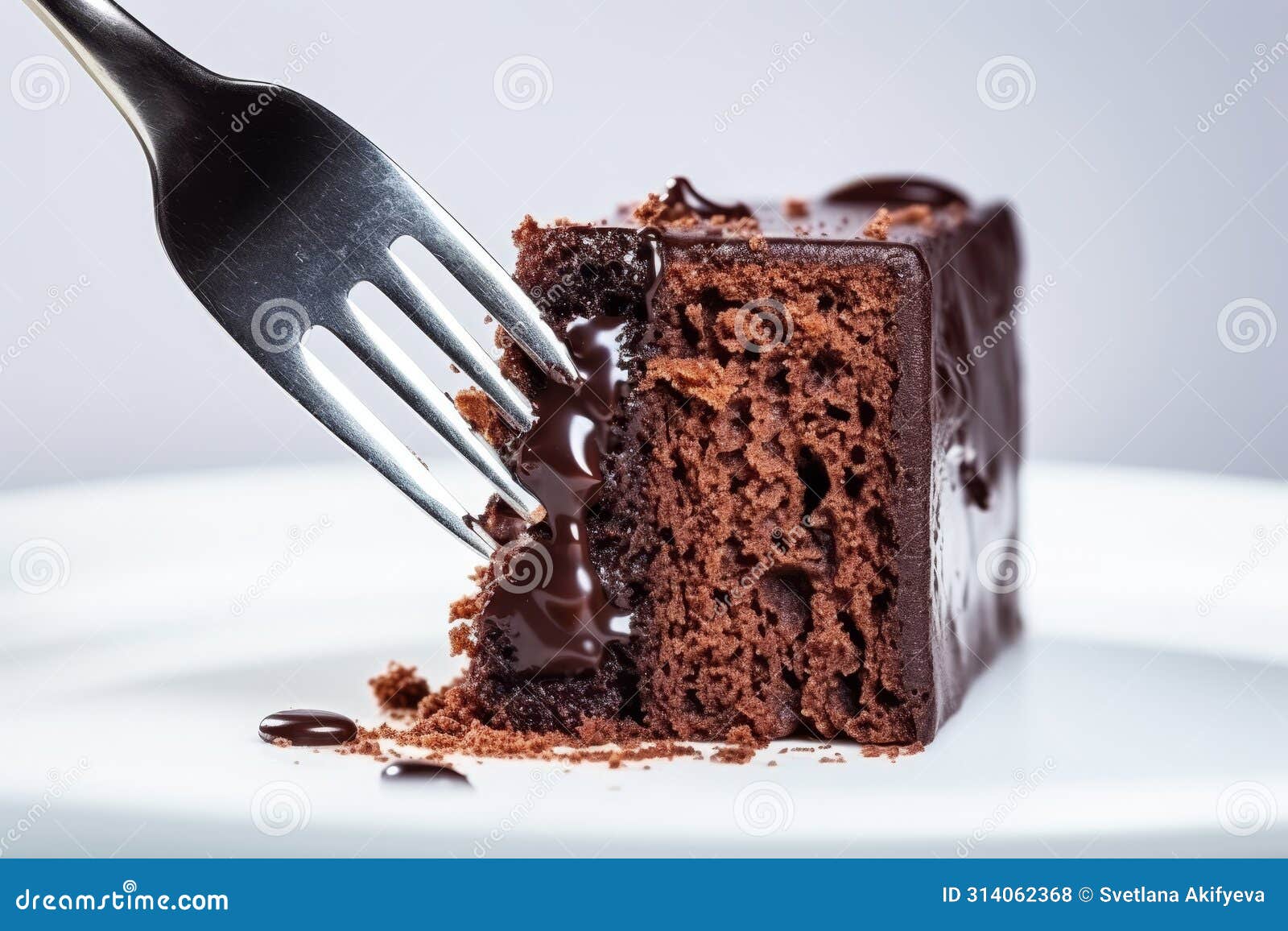 close-up display of fork with piece of cake on light background, depicting human reliance on food