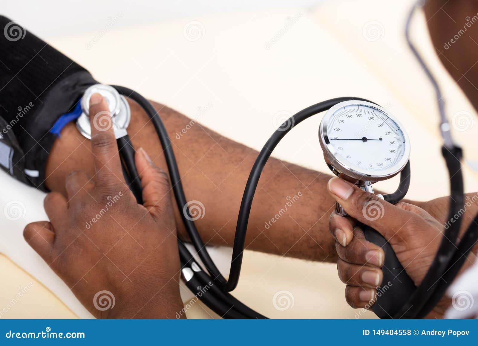doctor measuring blood pressure of patient