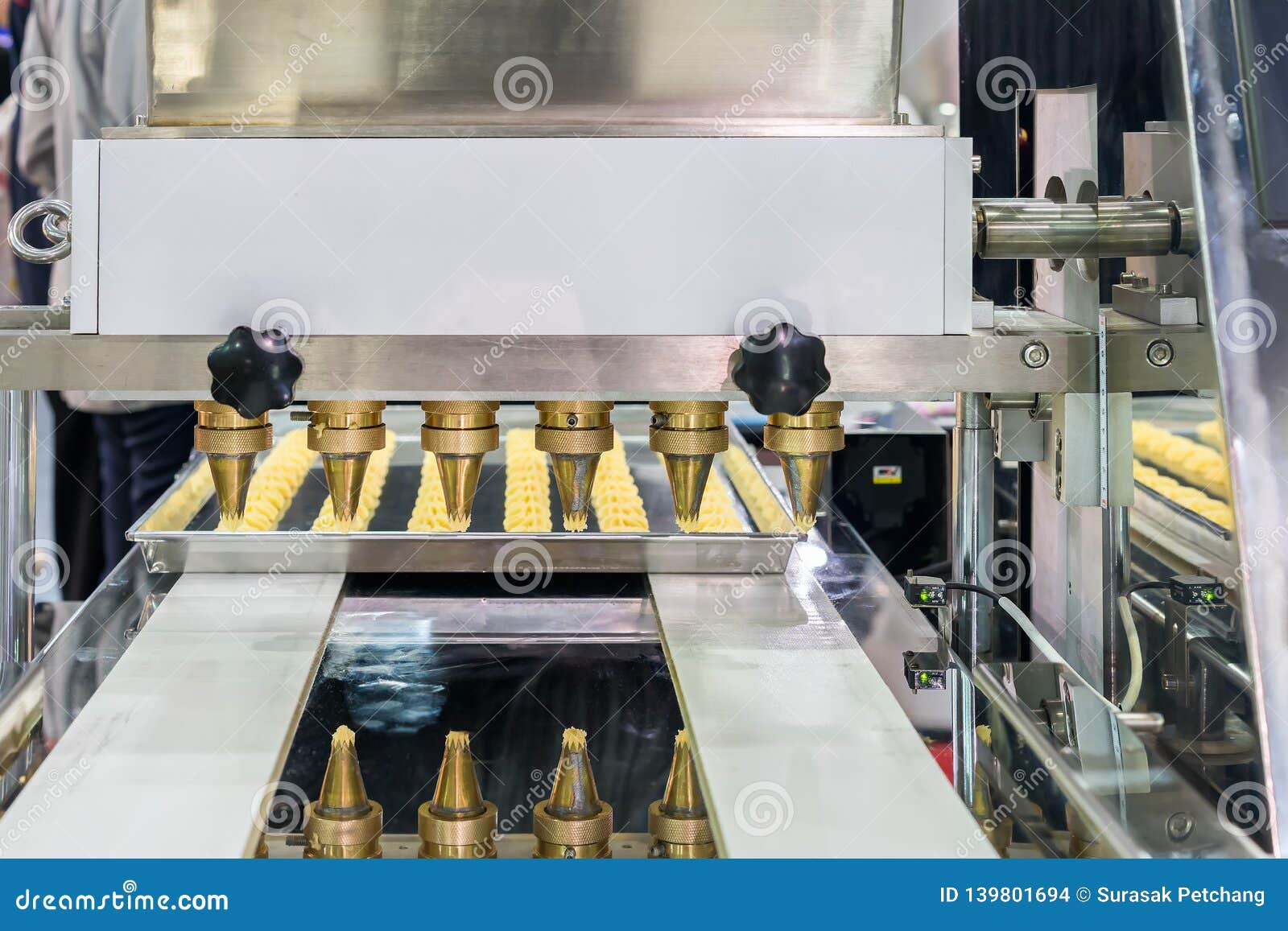 Close Up Dough or Cream and Nozzle Discharge of Automatic Biscuit or