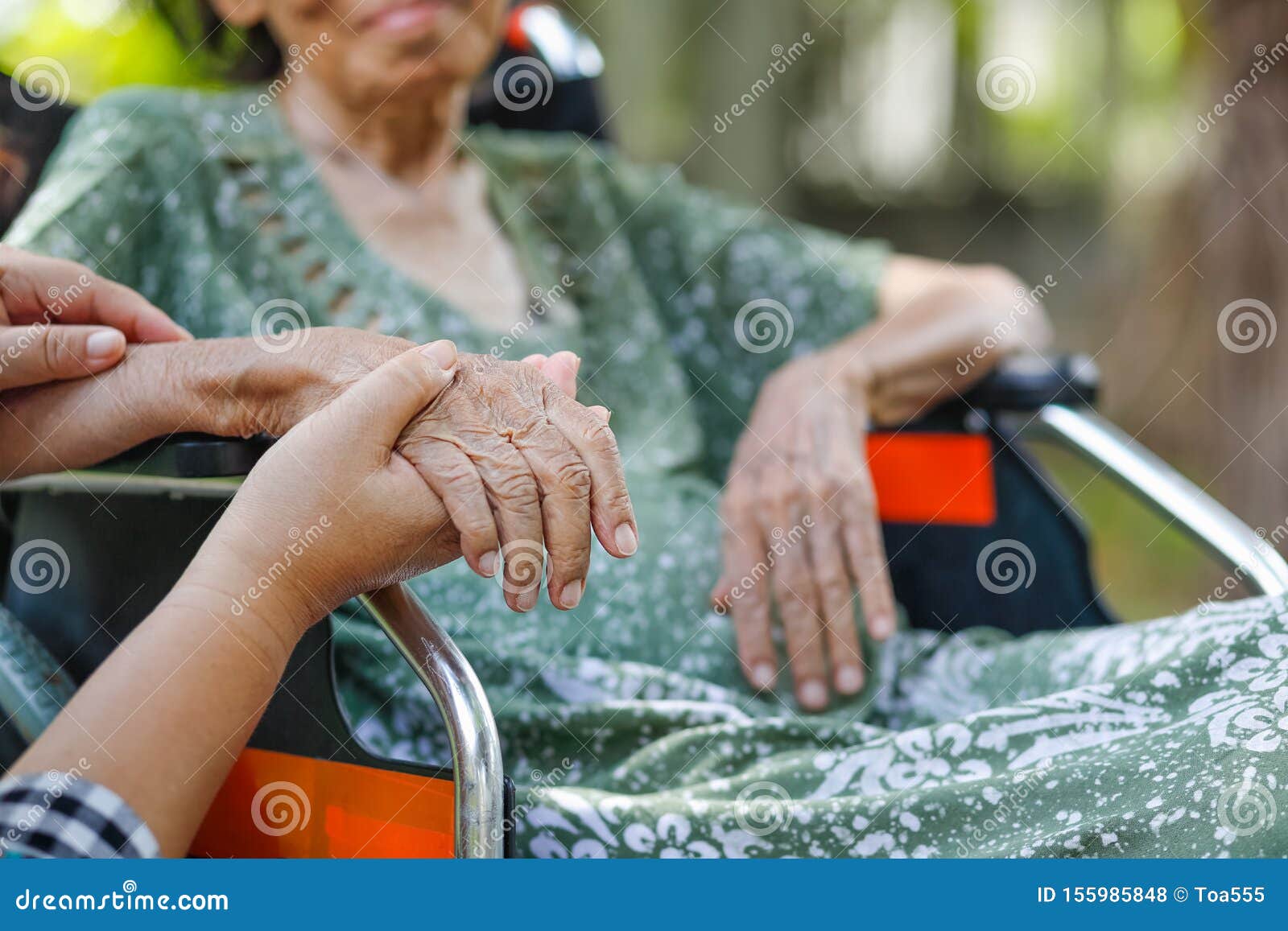 elderly asian woman on wheelchair at home with daughter take care