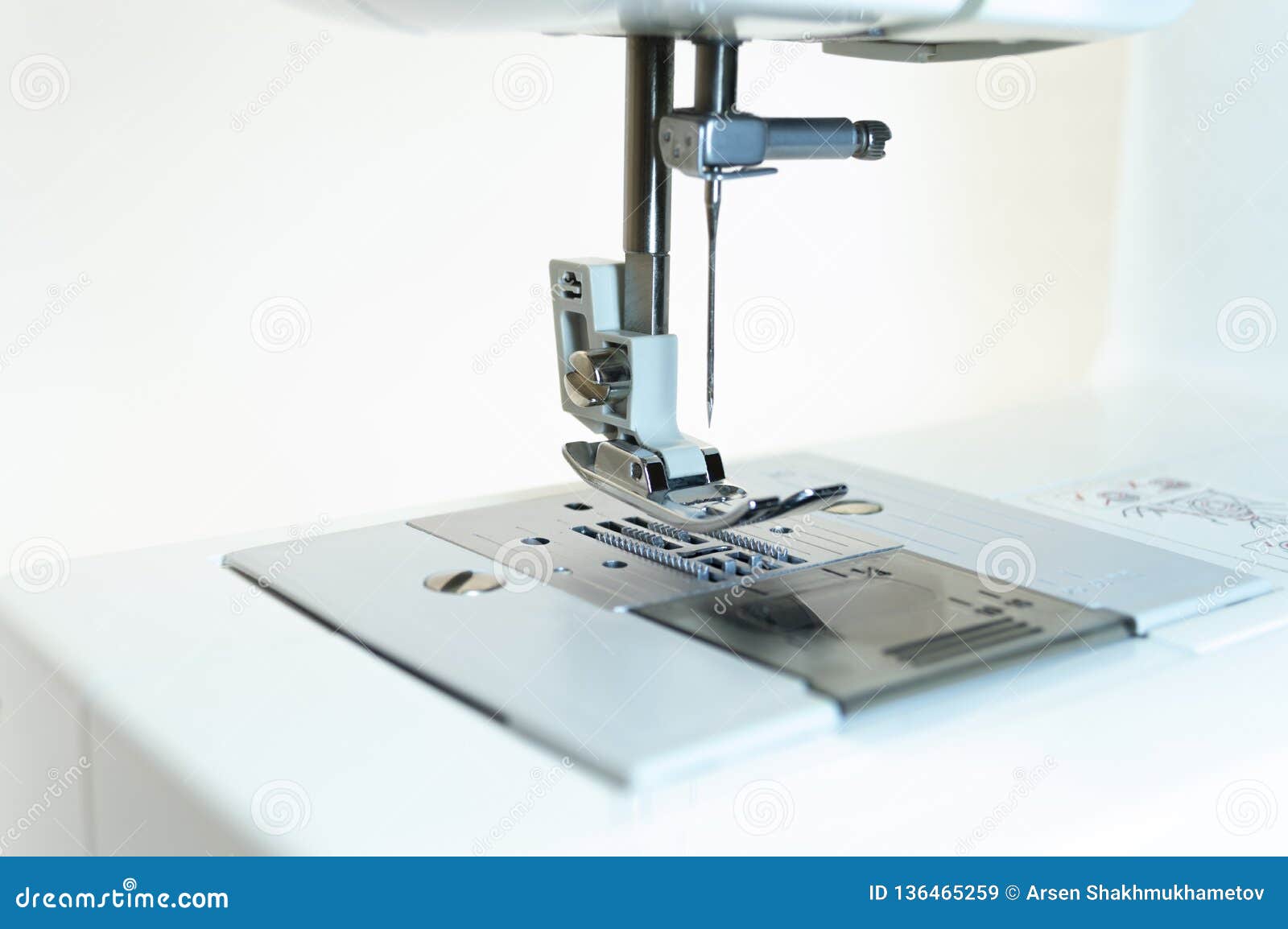 Closeup the Mechanism of the Sewing Machine. White Background. Stock