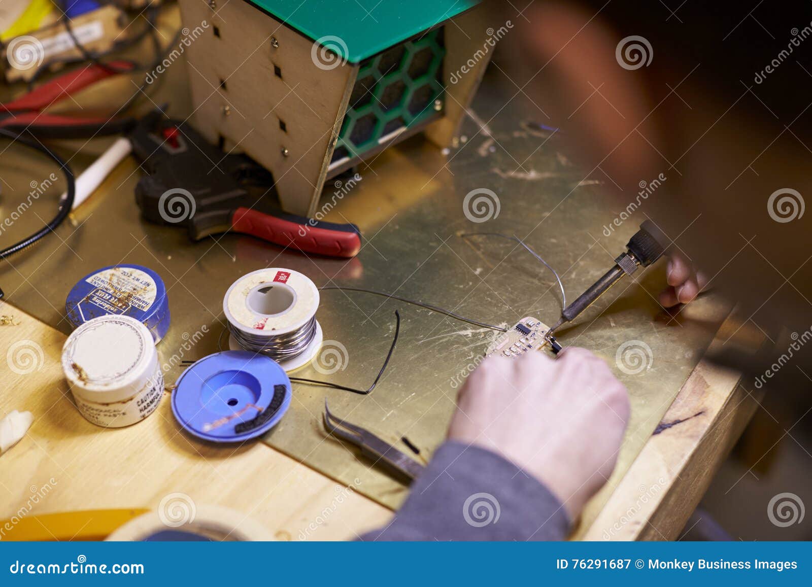 Close Up of Electrical Engineer Soldering Circuit Board Stock Image