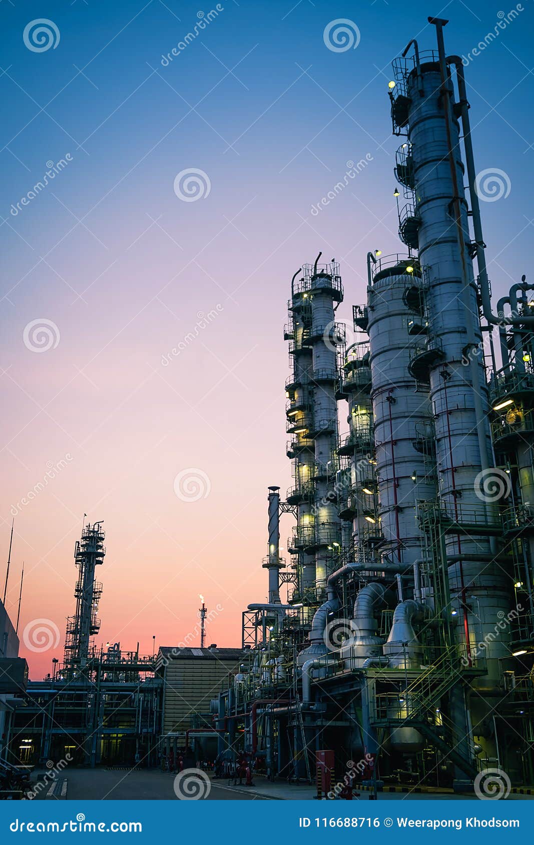 Distillation tower. Close up equipment tower of gas distillation with sky twilight background