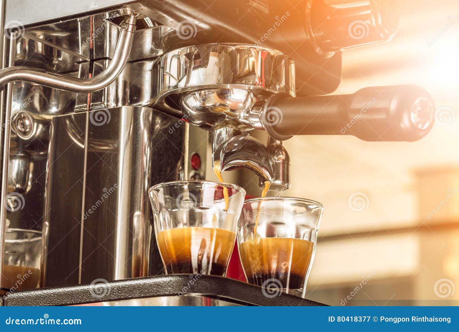 close-up of espresso pouring from coffee machine at the morning