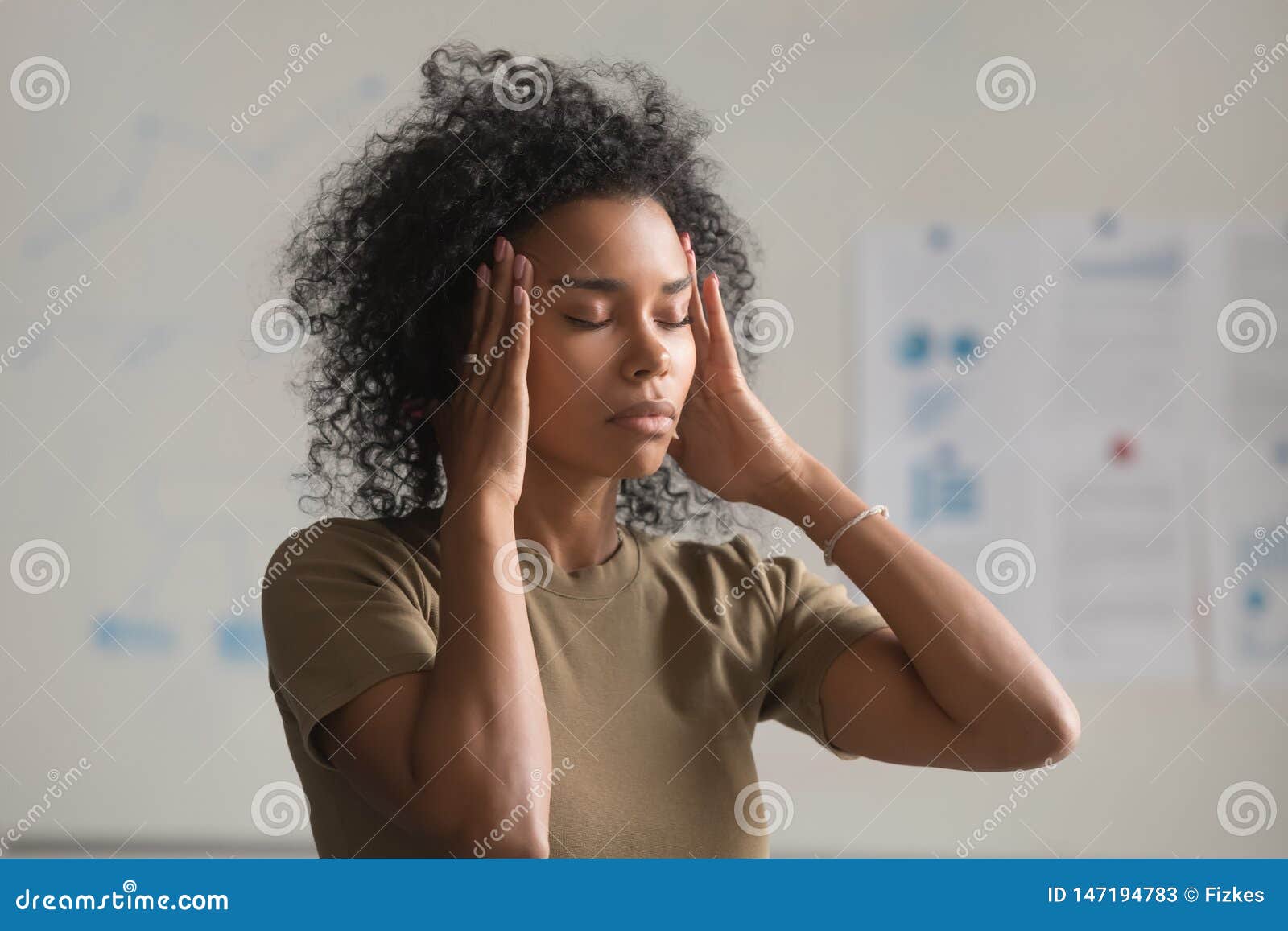 exhausted black woman worker massage temples having headache