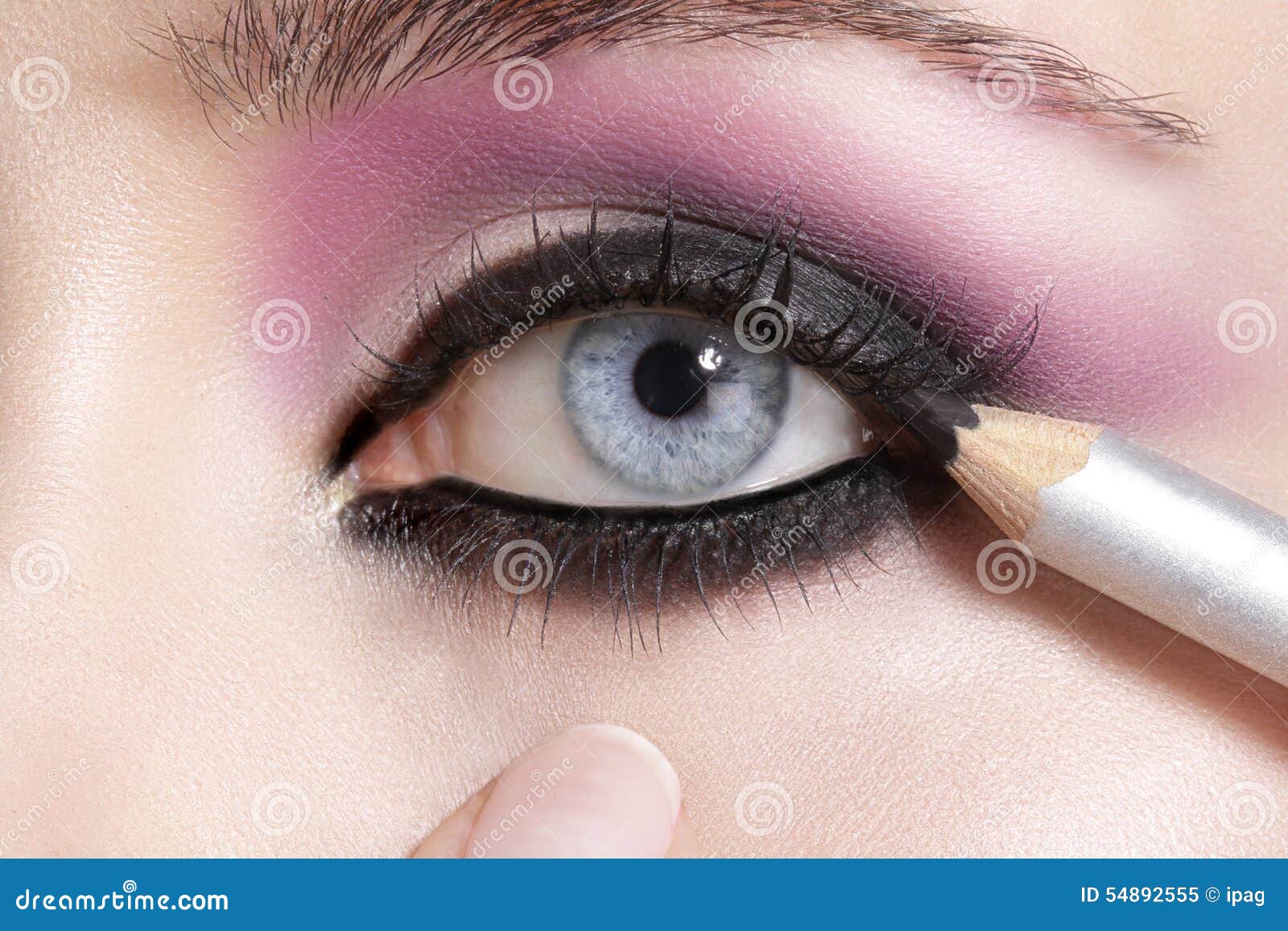 Close Up On Eyes Making Colorful Eyeshadows And Eyeliner Stock