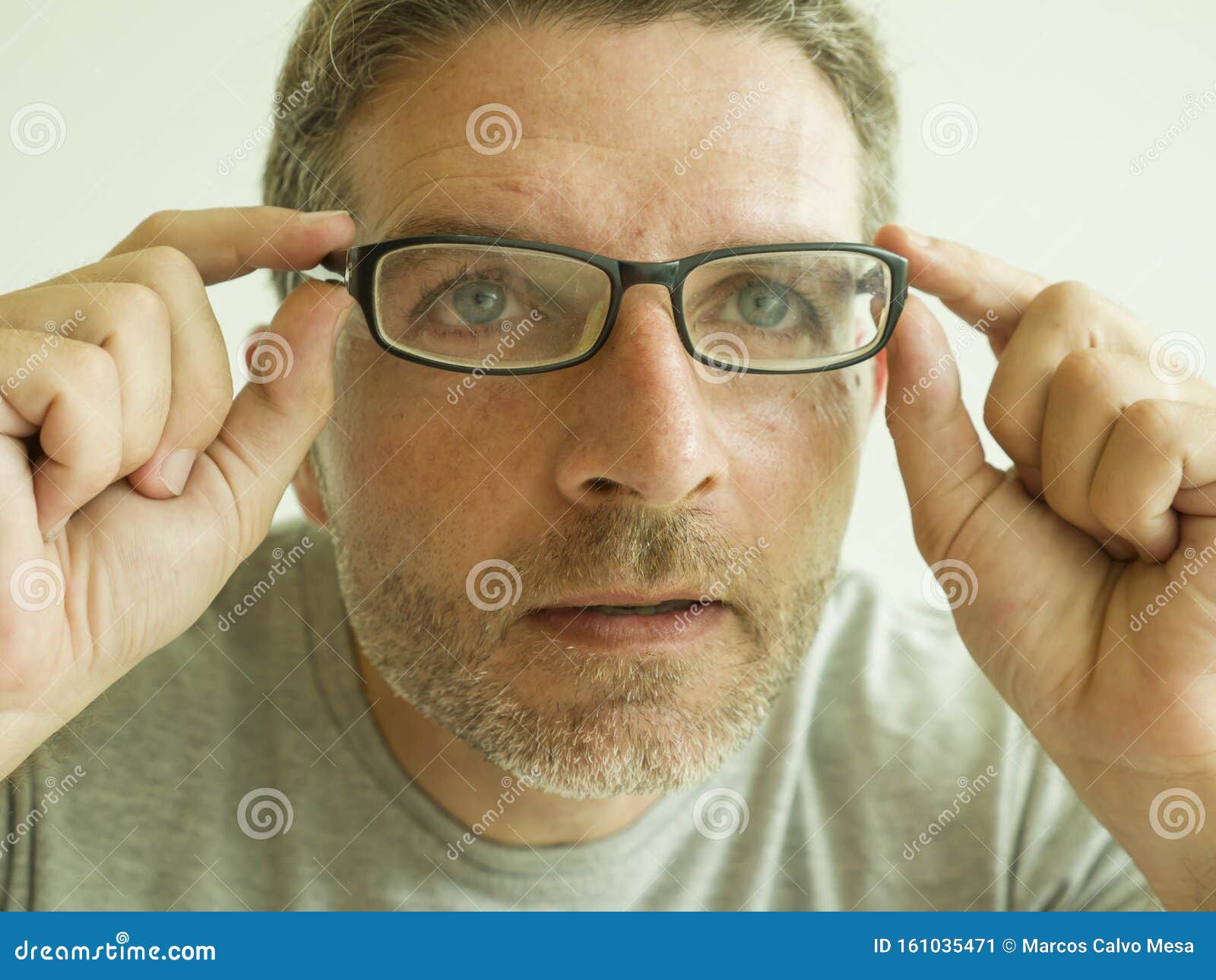 Close Up Face Portrait of Attractive Man Checking Vision Trying Glasses ...