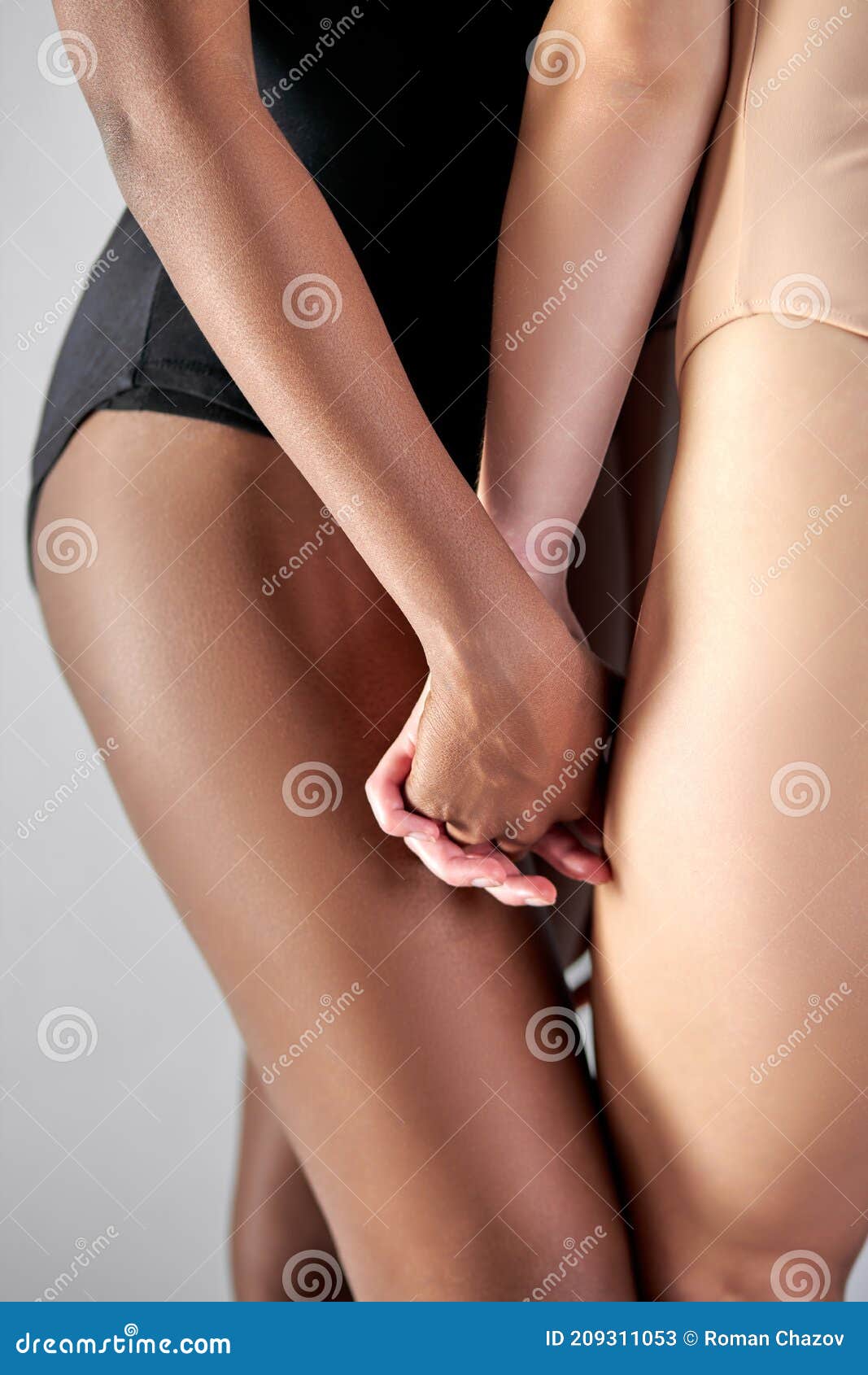 Close-up Faceless Half-naked Women Holding Each Otherand X27;s Hands Stock Image