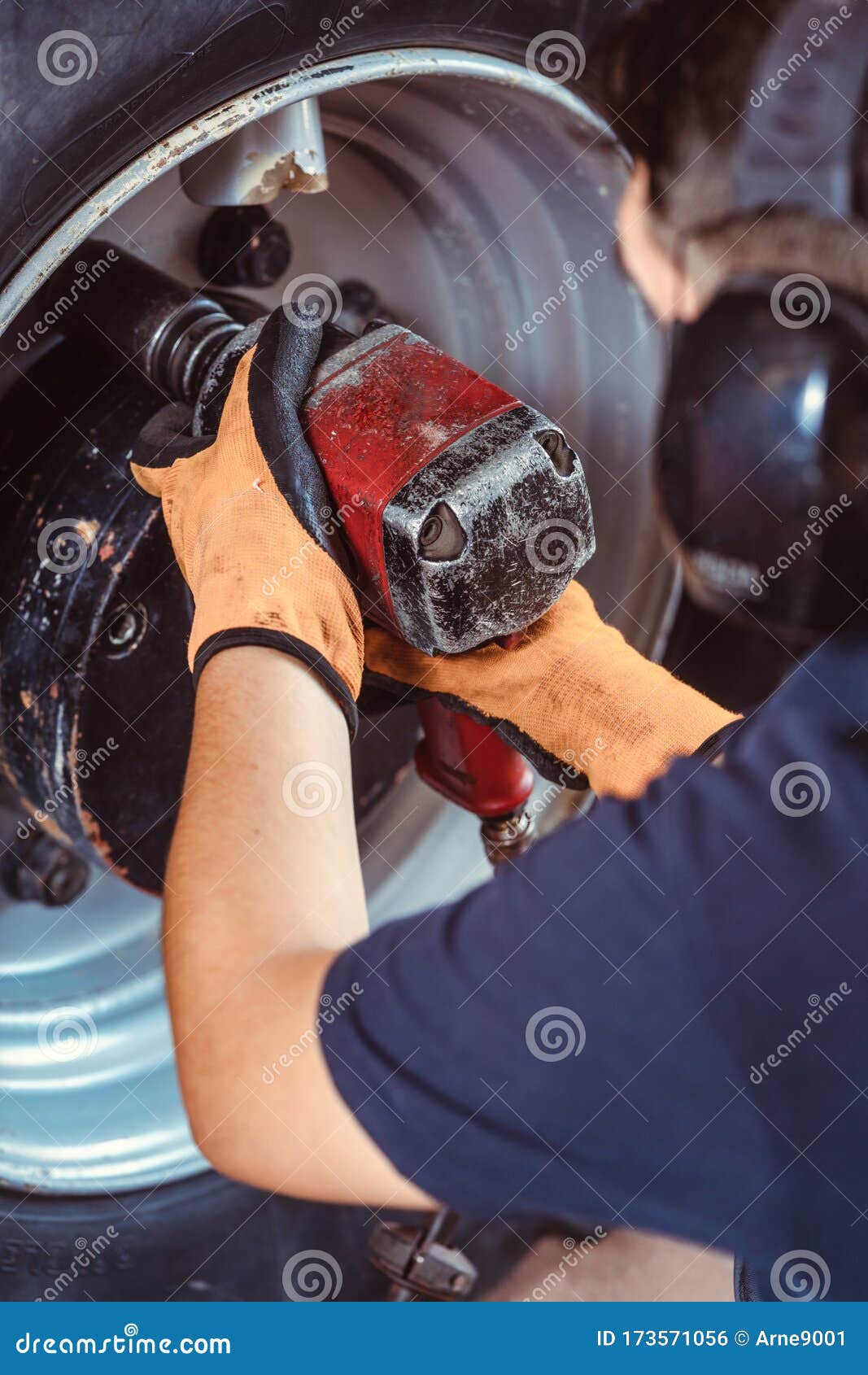 Closeup of Farm Machine Mechanic Working on Wheel Stock Photo Image