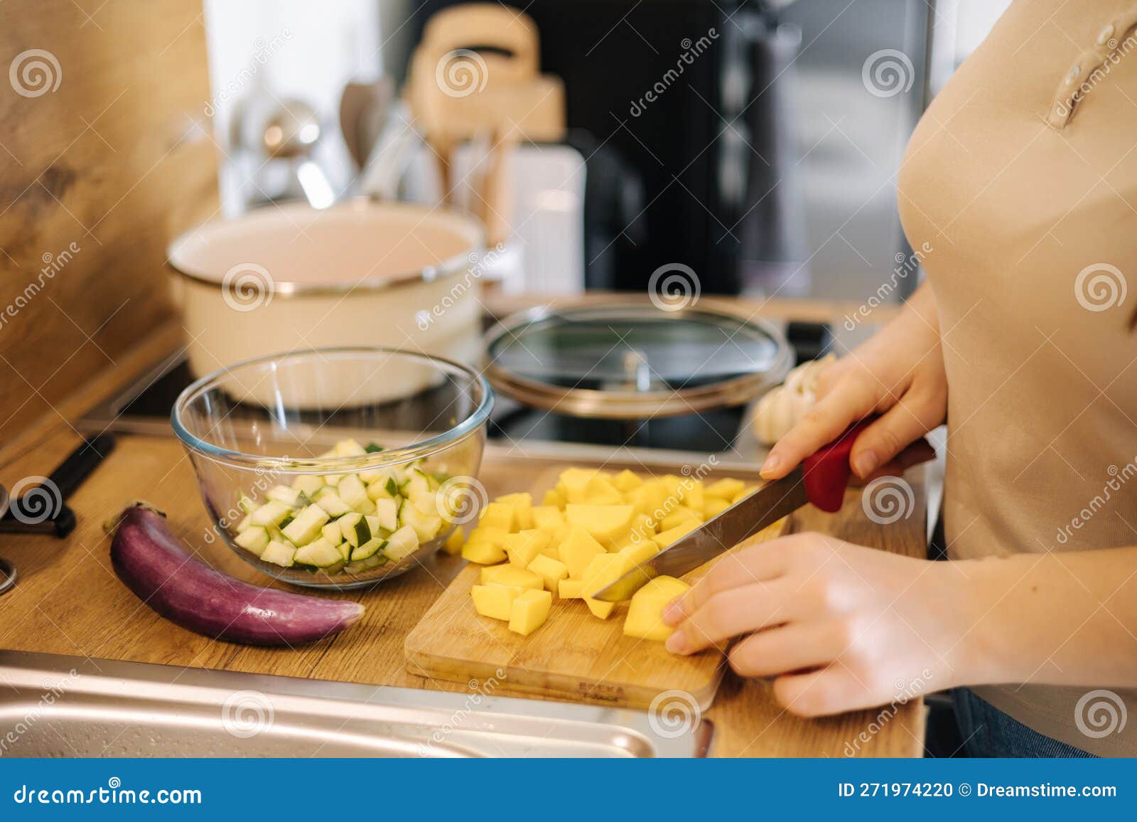 Close-up of Female Cutting Potato on Wooden Board at Home. Home Made ...