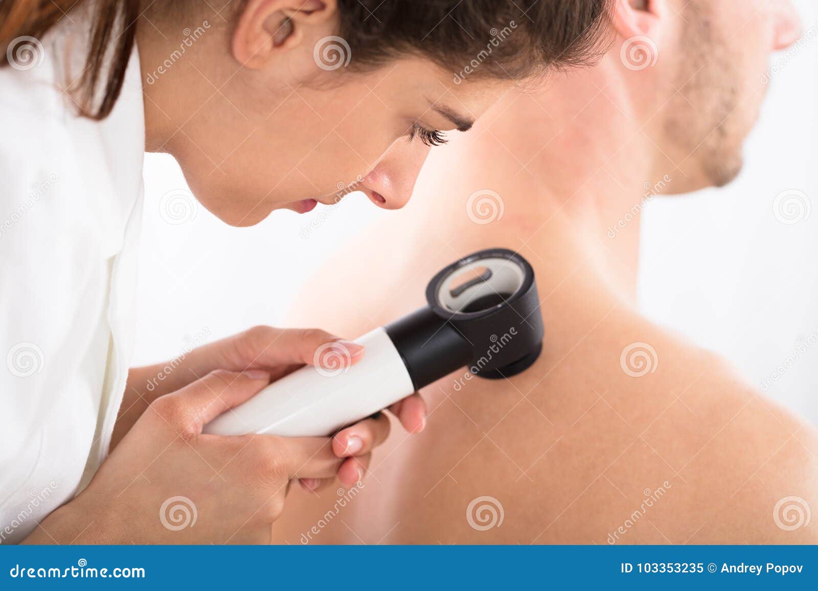 doctor using dermatoscope for skin examination