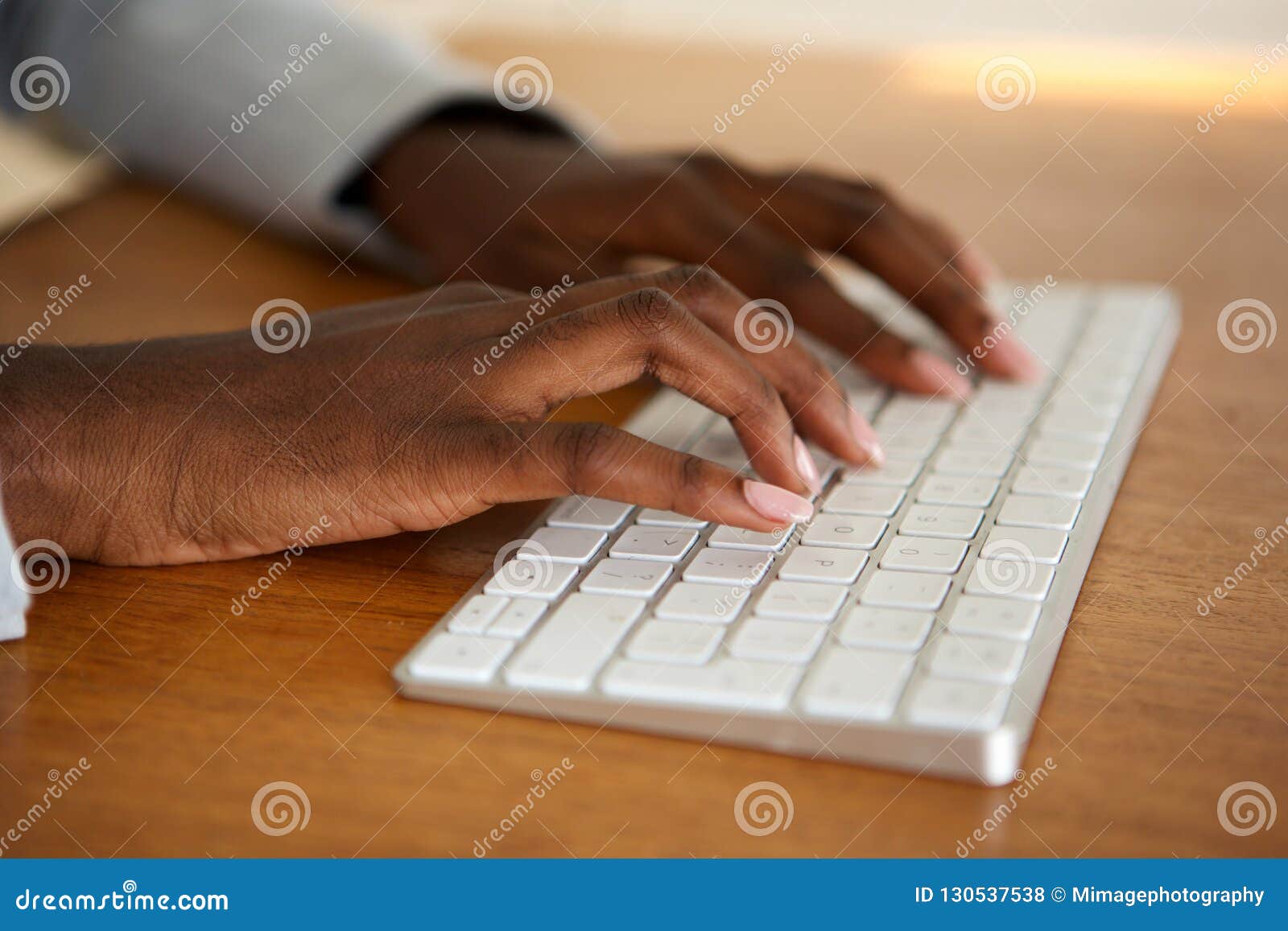 close up female hands typing on computer keyboard