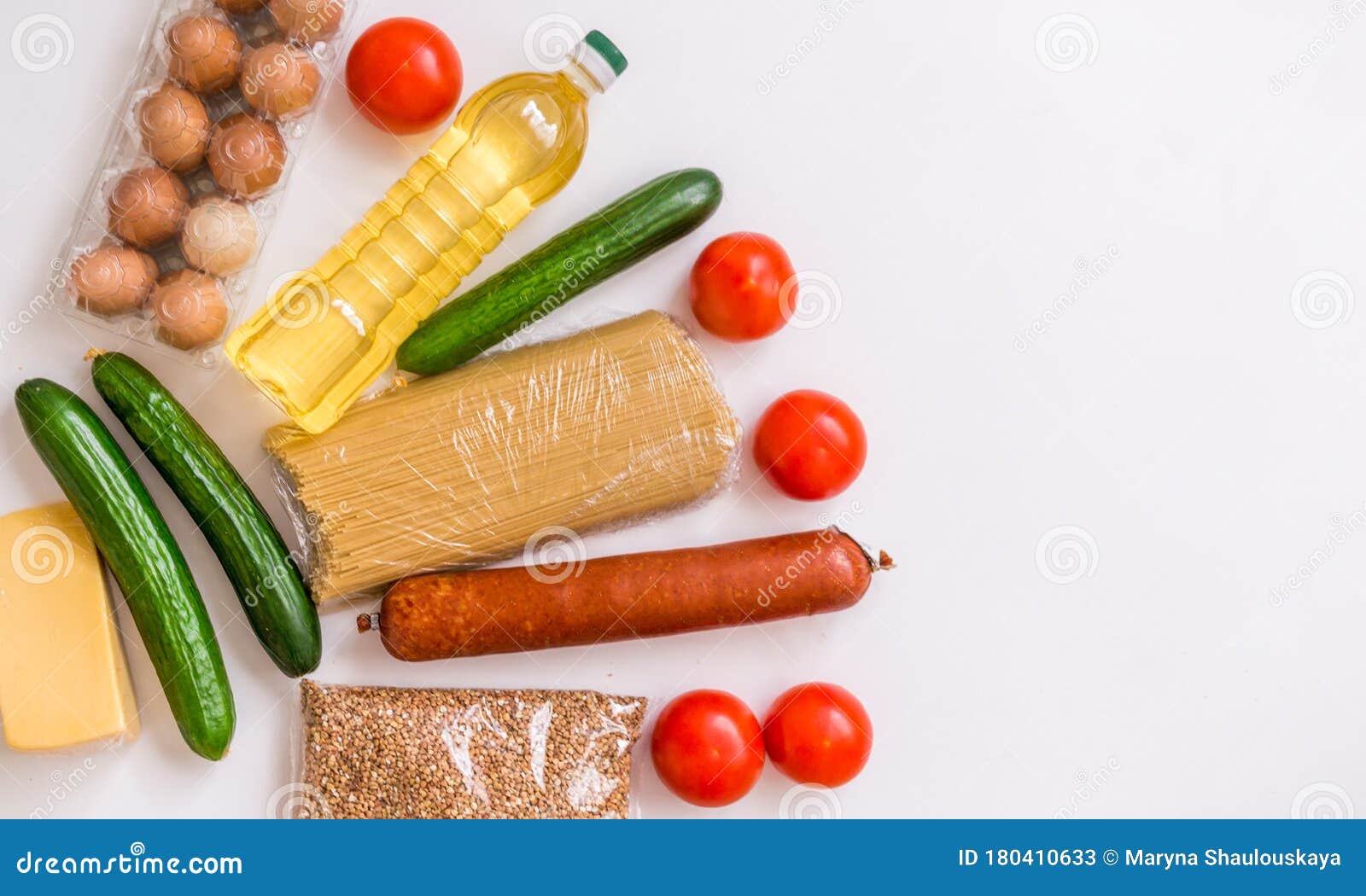 close-up of food. vegetables, groceries, cheese and eggs on a white background