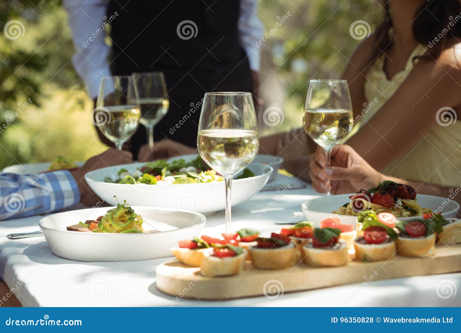 Closeup of Food and Wine Glass on Dining Table Stock Photo Image of