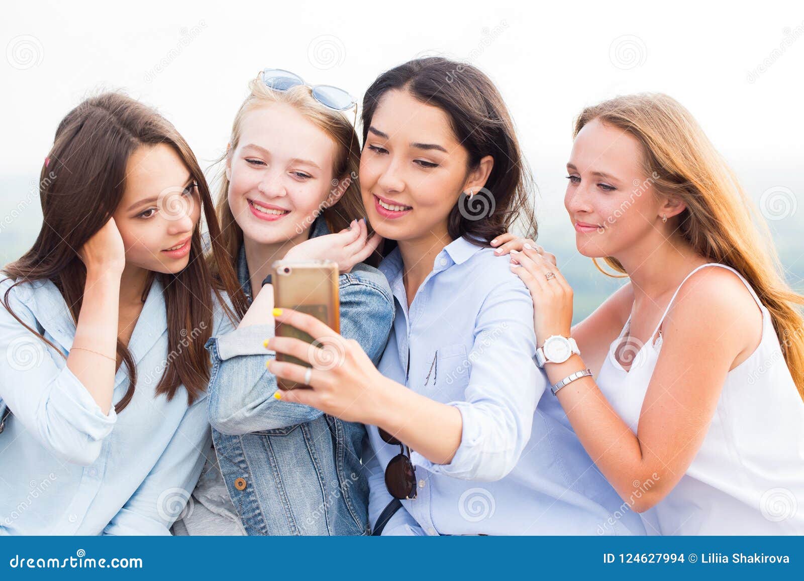 Close-up of Four Beautiful Young Female Students Doing Selfies and ...