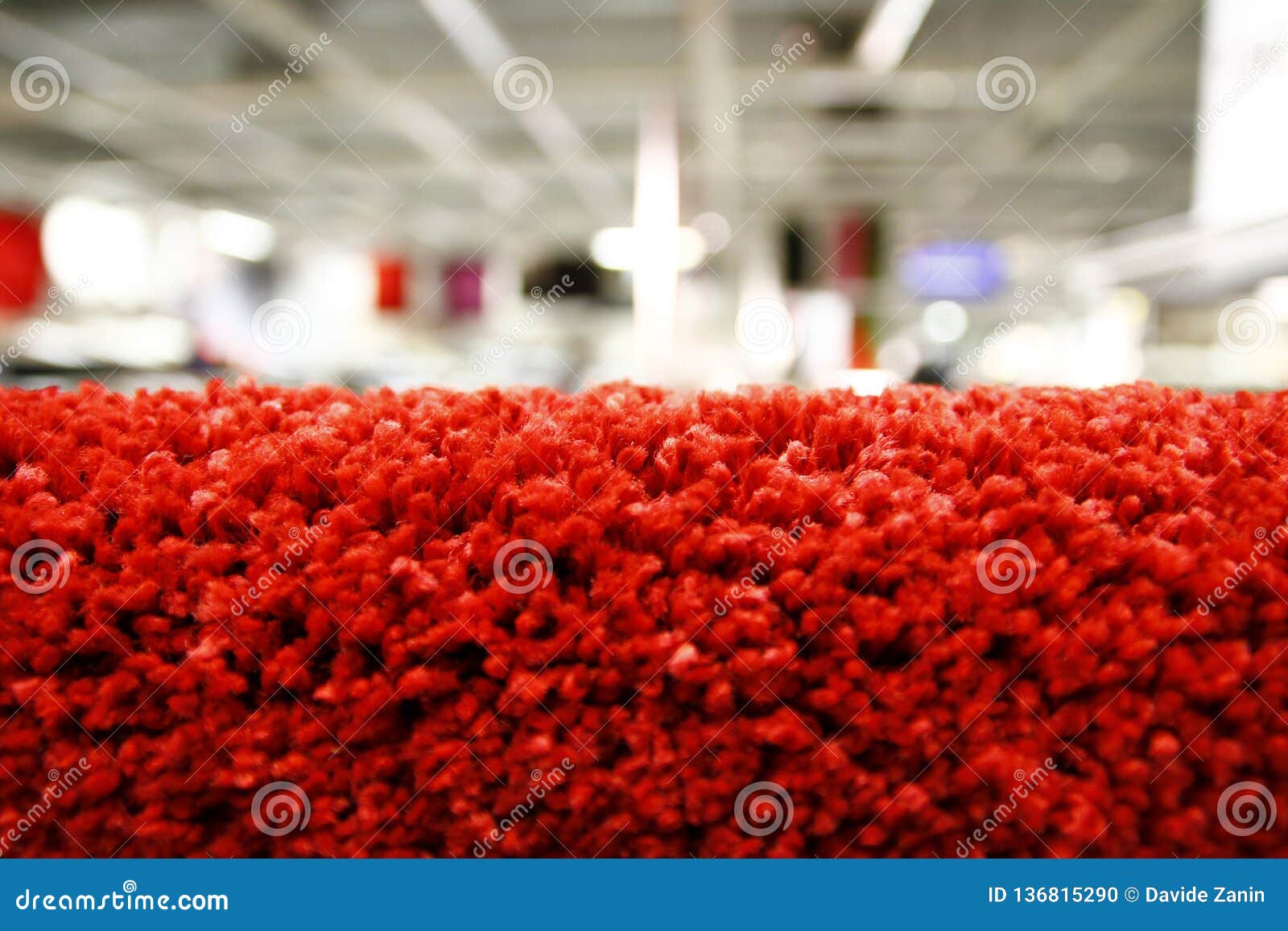 Close Up of a Fragment of Red Carpet in a Bright Shop Stock Photo