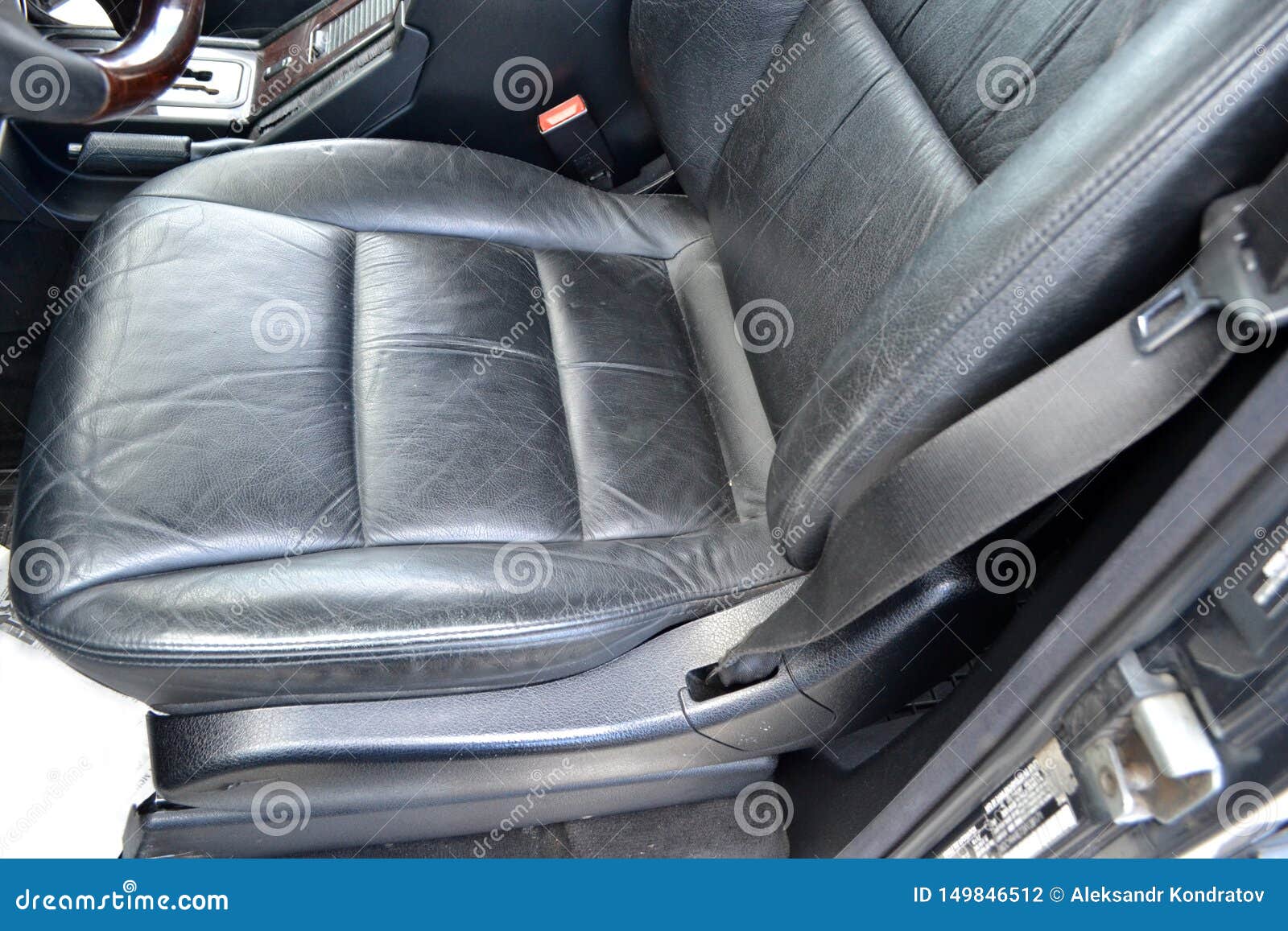 Car Detailer Cleaning and Protecting Leather Vehicle Interior