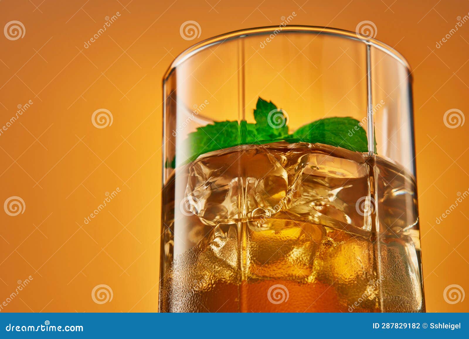 Closeup Glass of Refreshing Iced Tea with Mint Leaves. Studio Shot