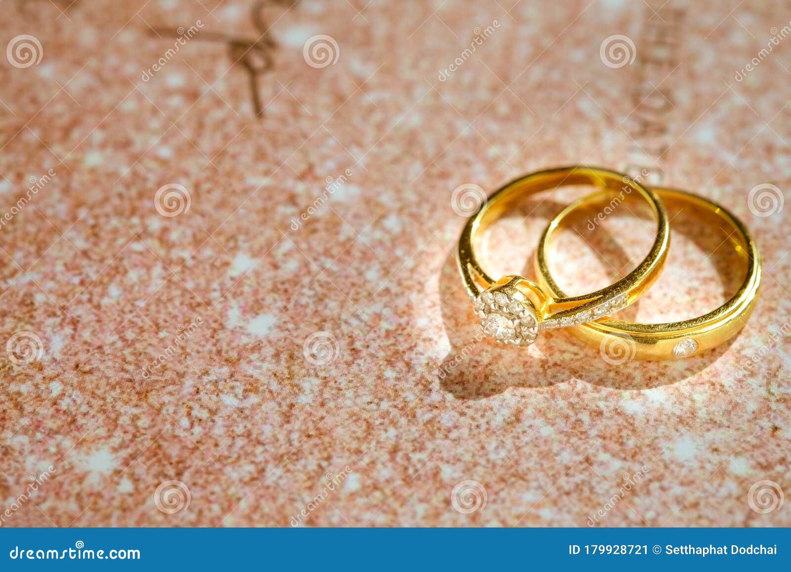 Close Up of Gold Wedding Rings or Engagement Rings on Wedding Invitation  Card Background. Stock Image - Image of celebration, card: 179928721