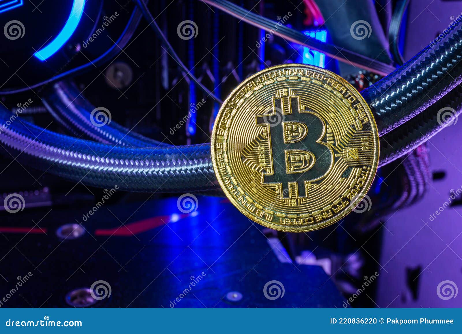 close up of golden bitcoin in computer. crypto currency concept and online trading of blockchain backed digital money.