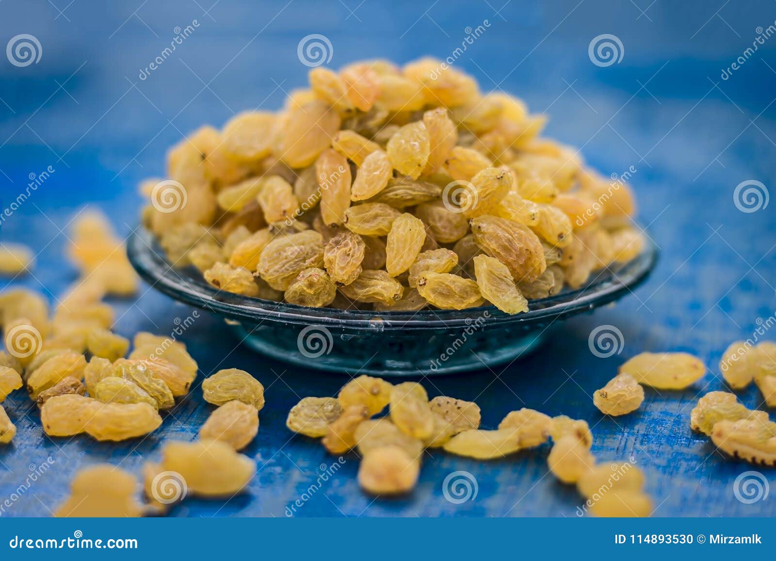 Close Up of Golden Raisins or Kishmish in a Bowl on Wooden Surface ...