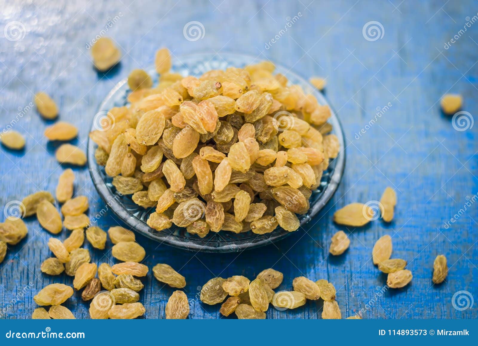 Close Up of Golden Raisins or Kishmish in a Bowl on Wooden Surface ...