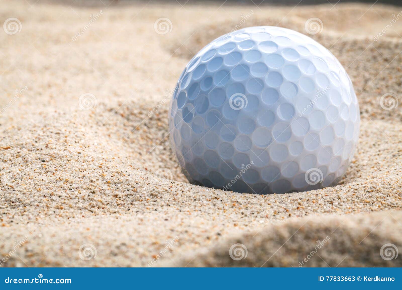 Close Up Golf Ball in Sand Bunker Shallow Depth of Field. a Gol Stock