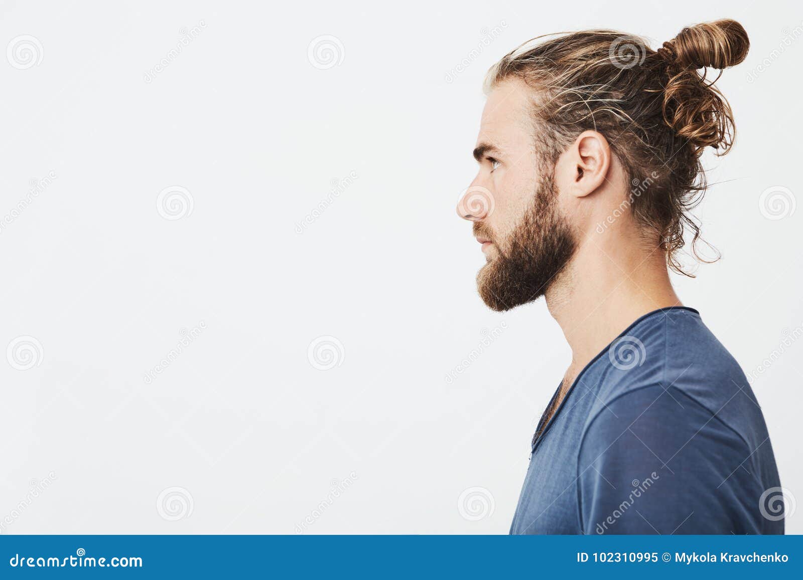 Close Up of Good-looking Bearded Hipster Guy with Hair in Bun, in Blue ...