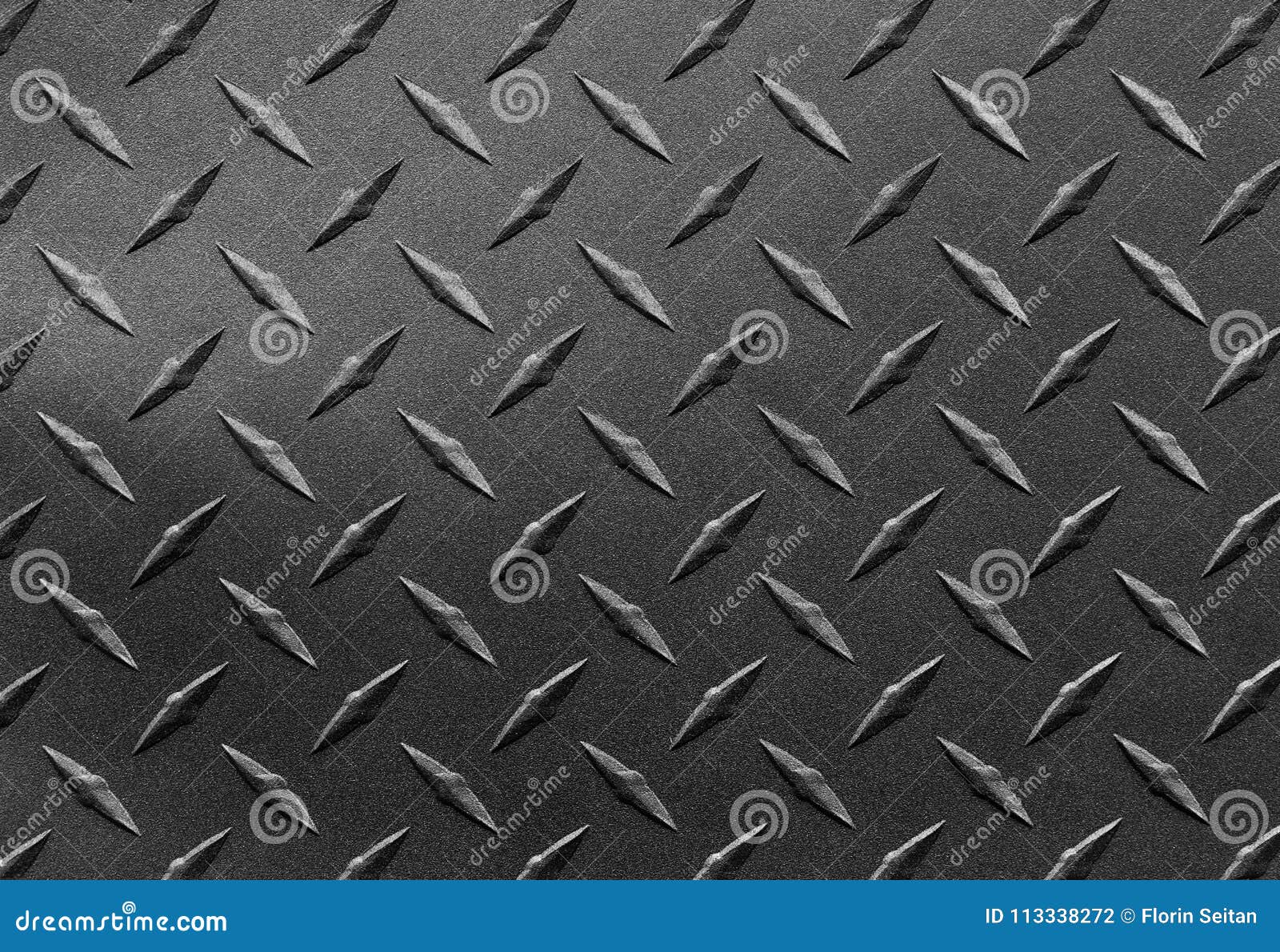Close Up of Grainy Textured Steel Sheet with Diamond Plate Pattern