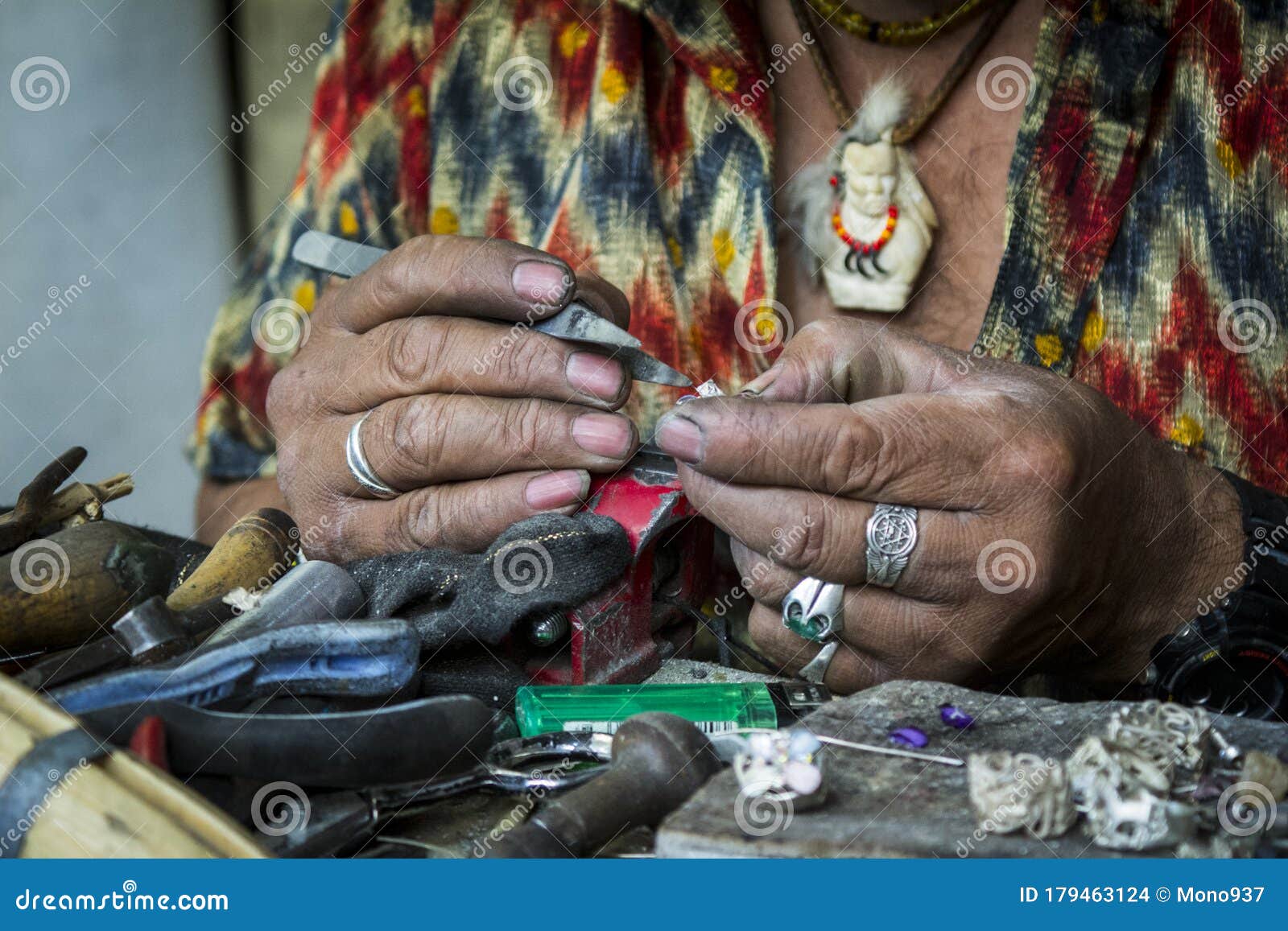 jeweler`s hands working on his craft