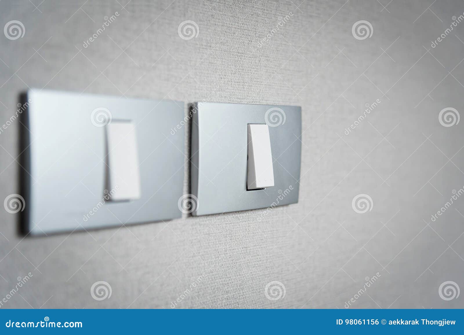 Close Up Grey Light Switches On Texture Background. Stock Photo Image