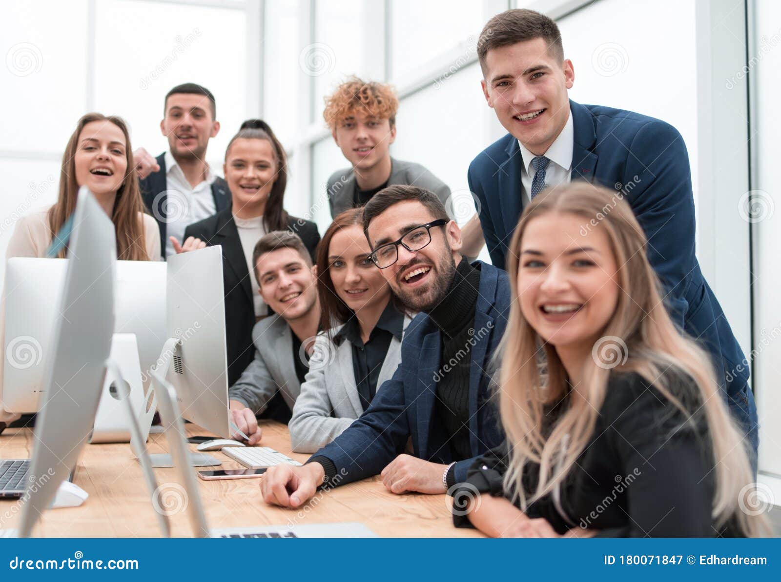 Close Up.a Group of Happy Employees in the Workplace Stock Image