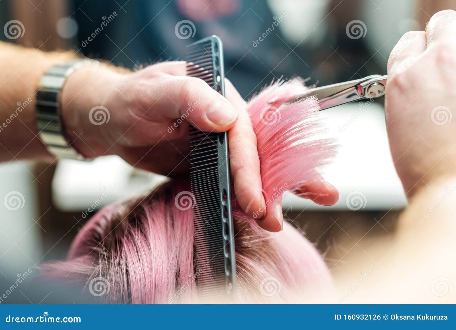 Close Up Of Hairdresser S Hands Are Cutting Pink Tips While