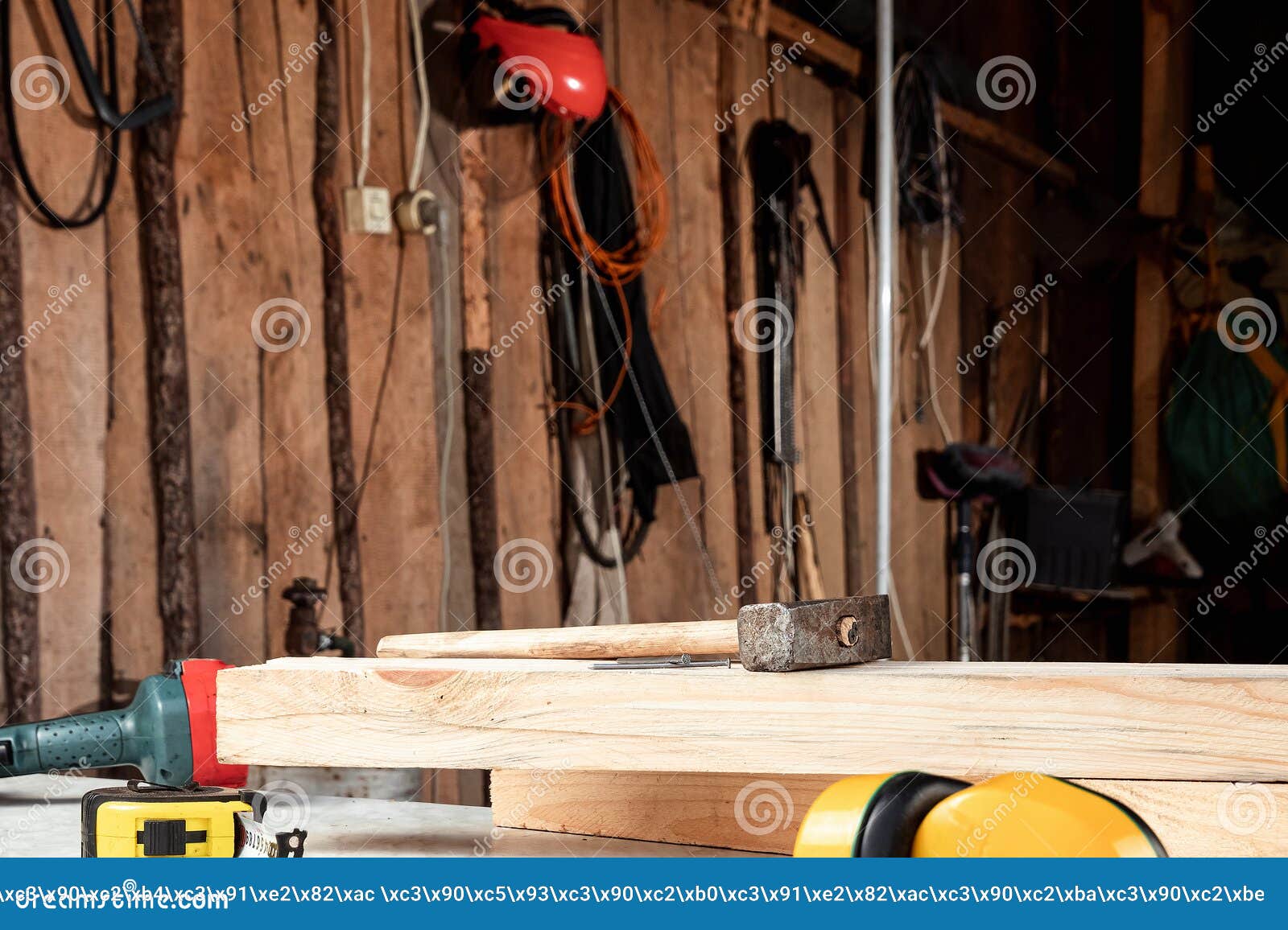 Closeup of Hammer and Nails on a Wooden Board. Construction, Carpentry