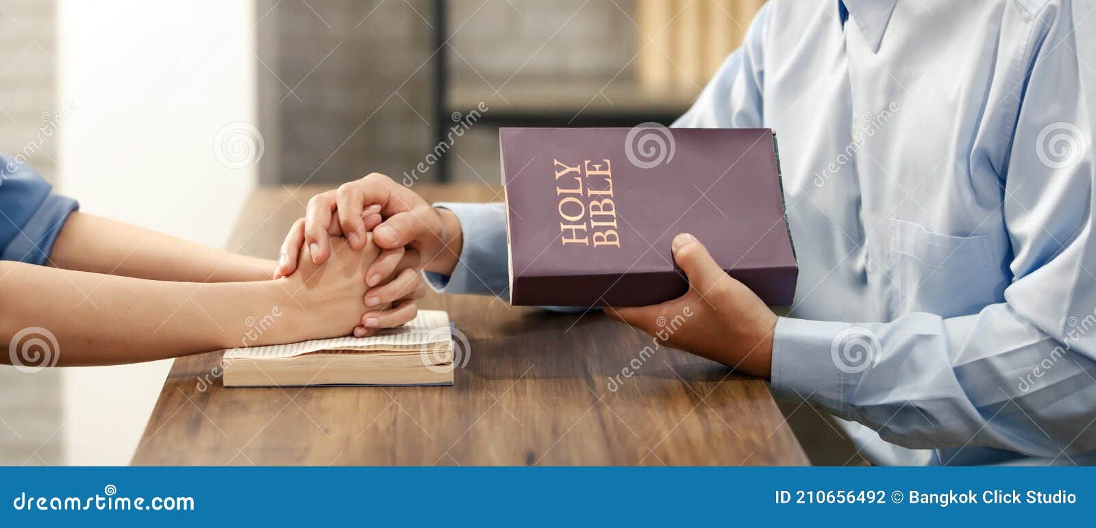 Close Up Hand. Asian Man Holding A Bible And A Woman`s ...