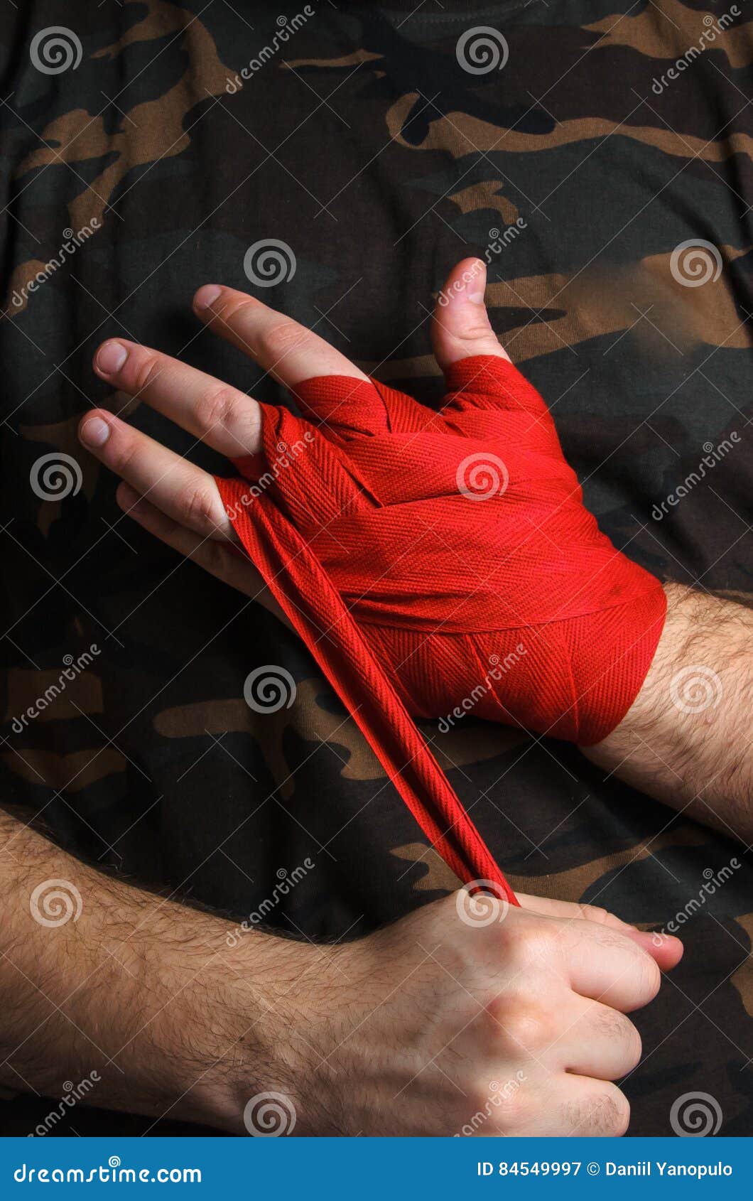 Closeup of Hand Boxer Pulls Wrist Wraps before the Fight Stock Image