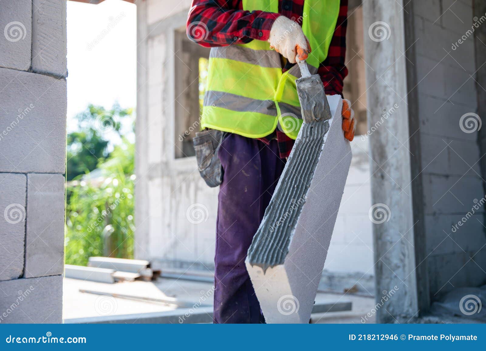 Closeup Hand of Bricklayer Builder Working Autoclaved Aerated with