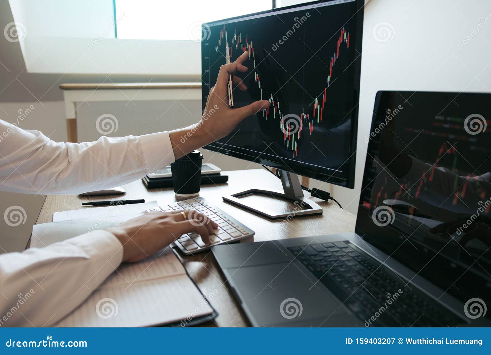 close up of hand investors are pointing to laptop computer that have investment information stock markets and partners taking
