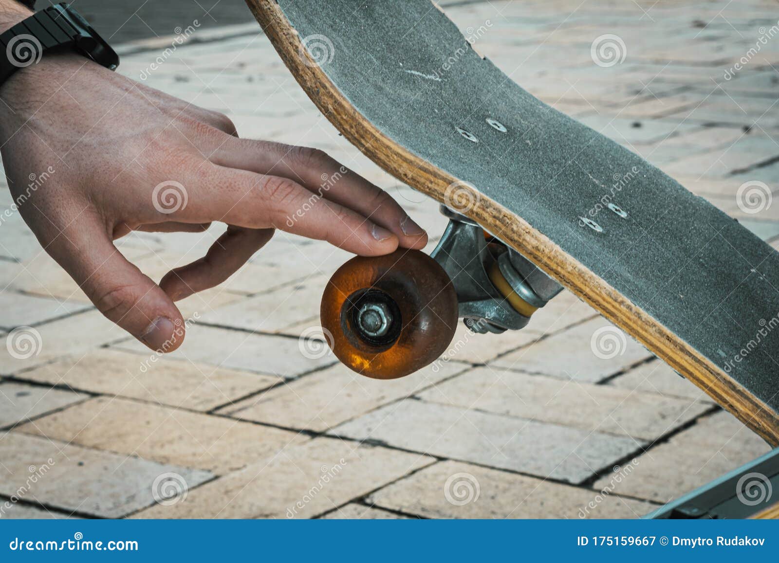 Close Up of Hand Touching Skateboard Wheel Stock Image Image of