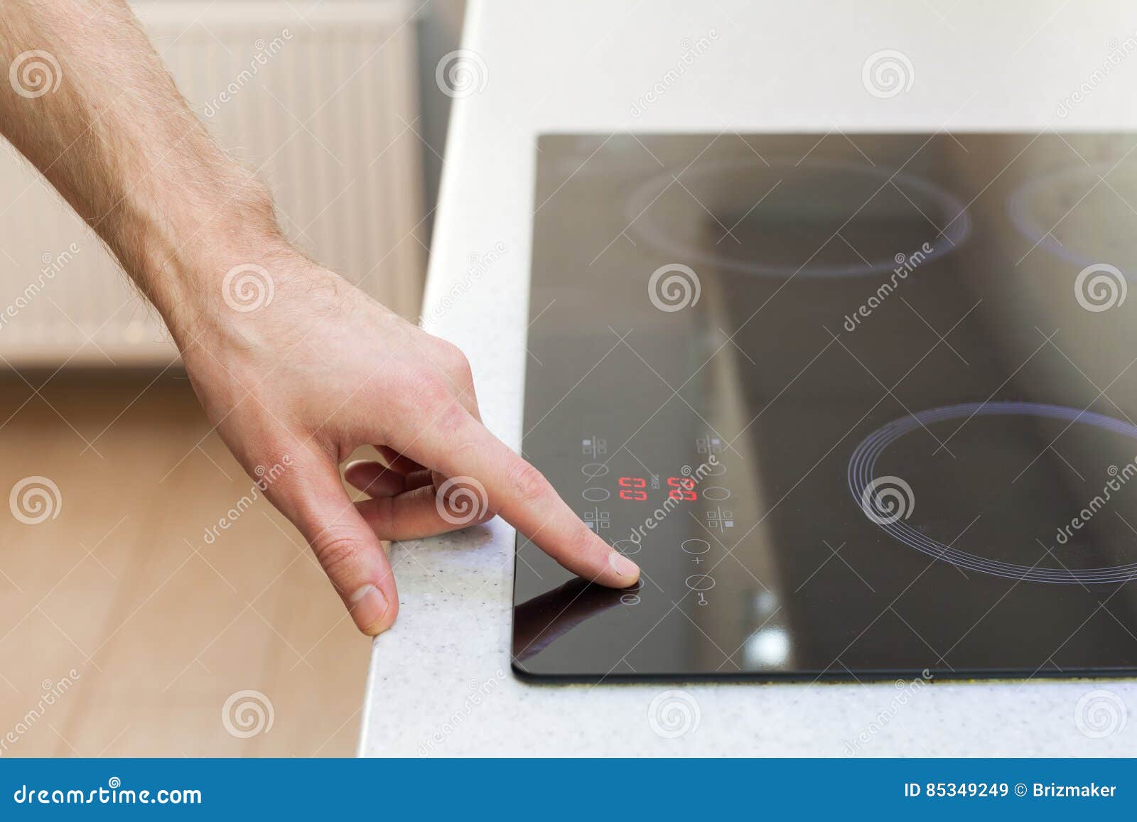 Close Up of Hand Turning on Ceramic Stove. Stock Image Image of energy, plate 85349249