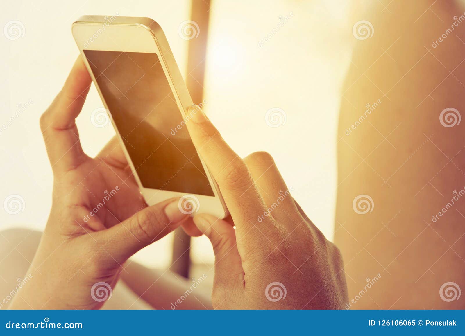 close up of hand typing on phone