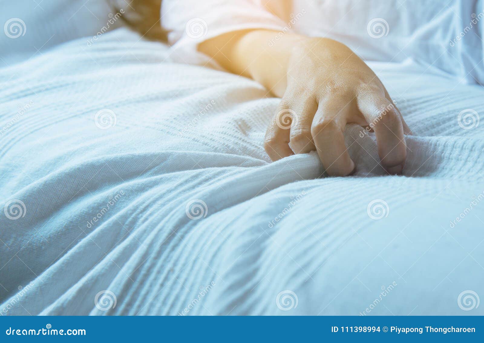 Close Up of Hand Woman Sign Orgasm, Finger Female Pulling White Bedsheet, Concept of Sexual Relations Stock Photo photo