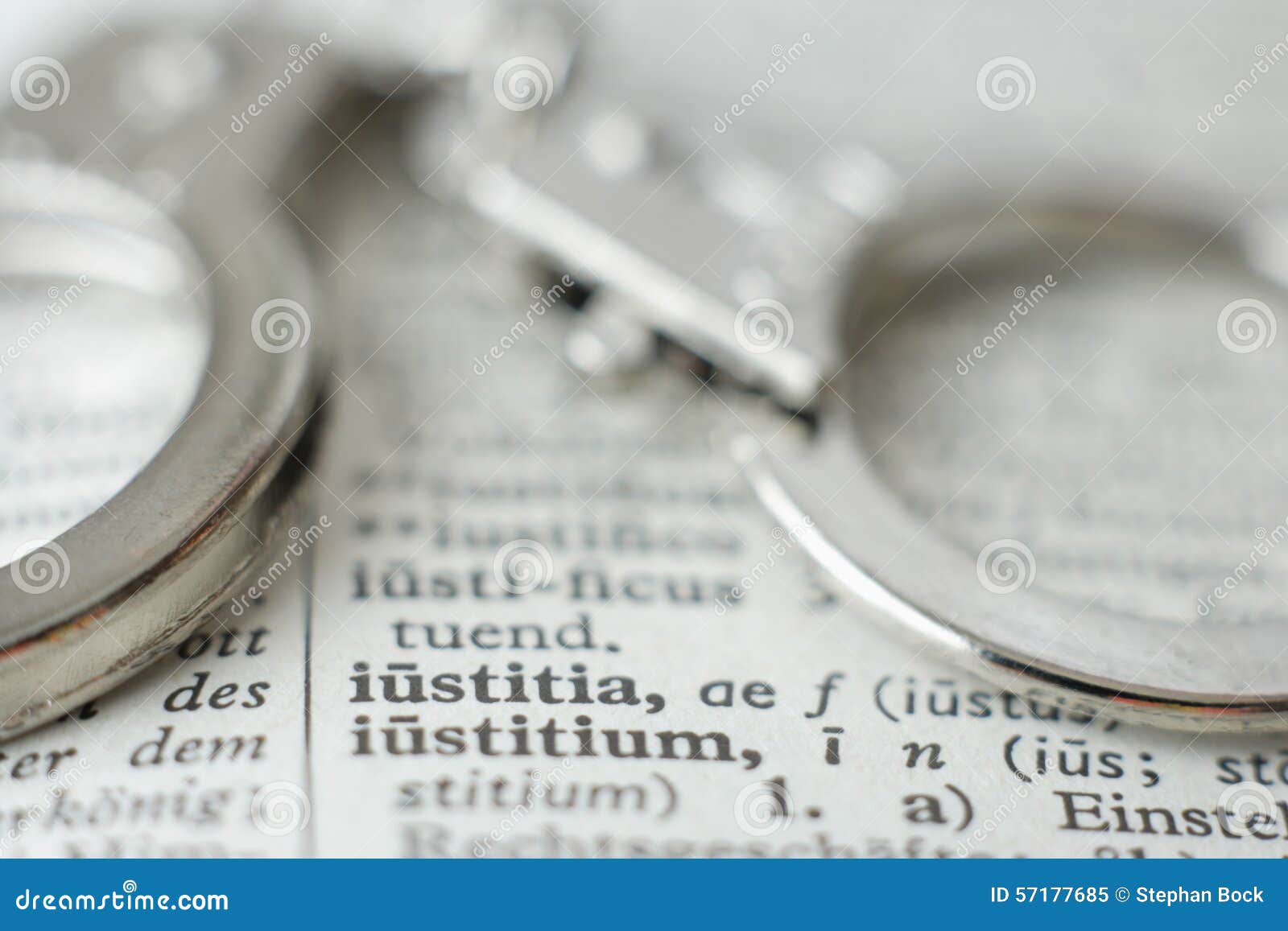 Close Up of Handcuffs on Dictionary Stock Image Image of focus