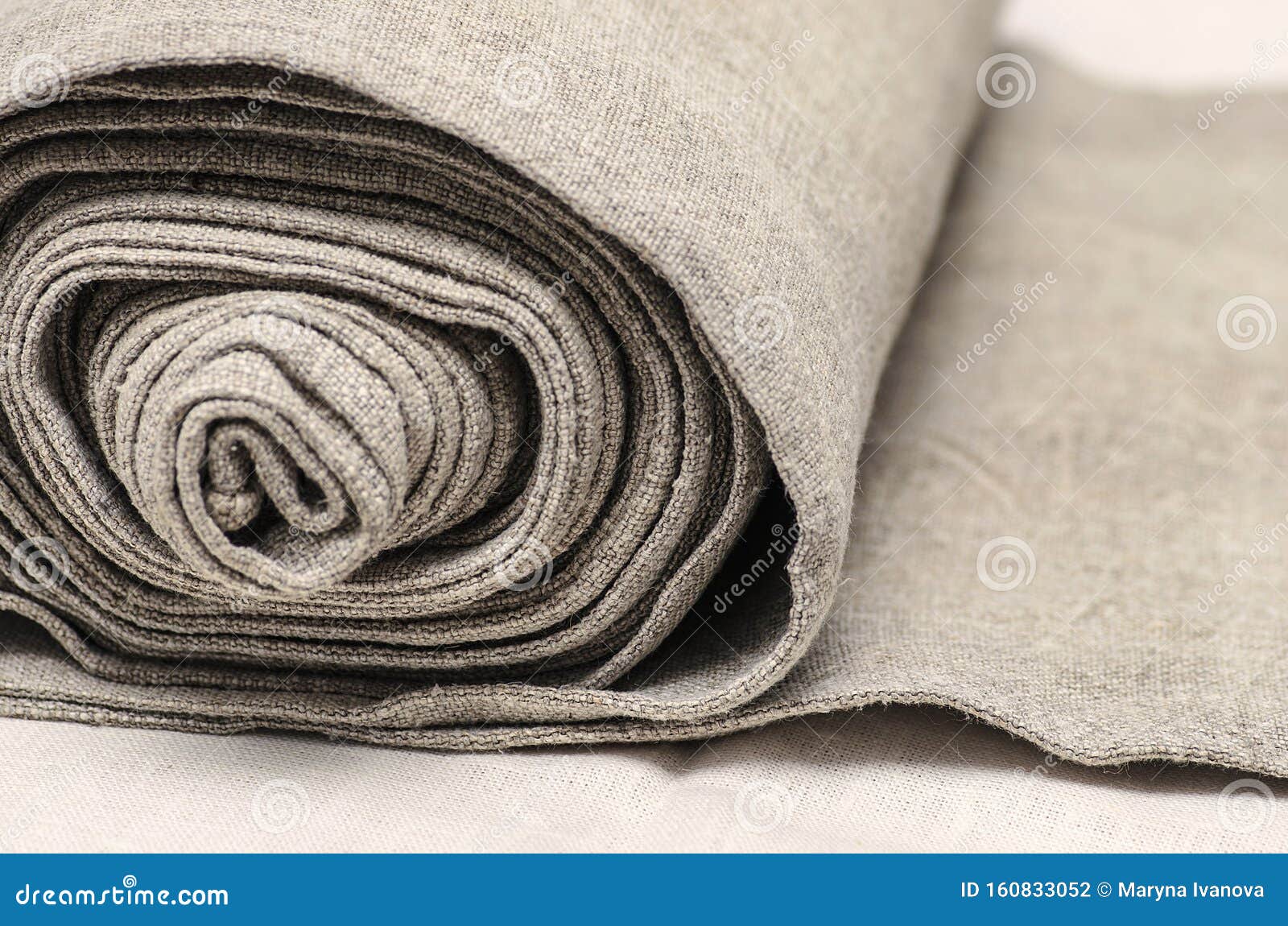 close up of handmaiden textile canvas in the roll. homespun hemp unpainted cloth