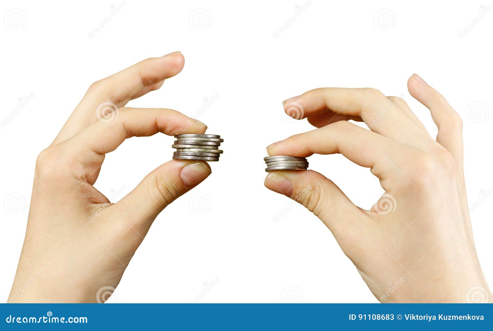 close up. hands compare two piles of coins of different sizes, i