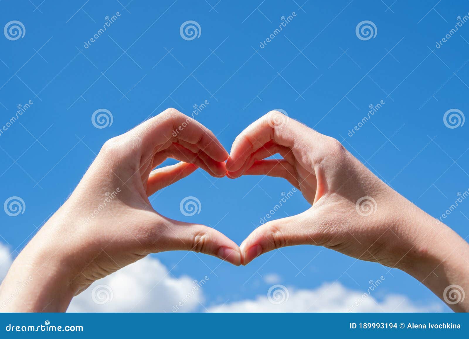 Close-up of Hands Making a Heart Symbol on a Background of Blue Sky and  Clouds. Love, Charity, Valentines Day Concept Stock Photo - Image of  person, closeup: 189993194
