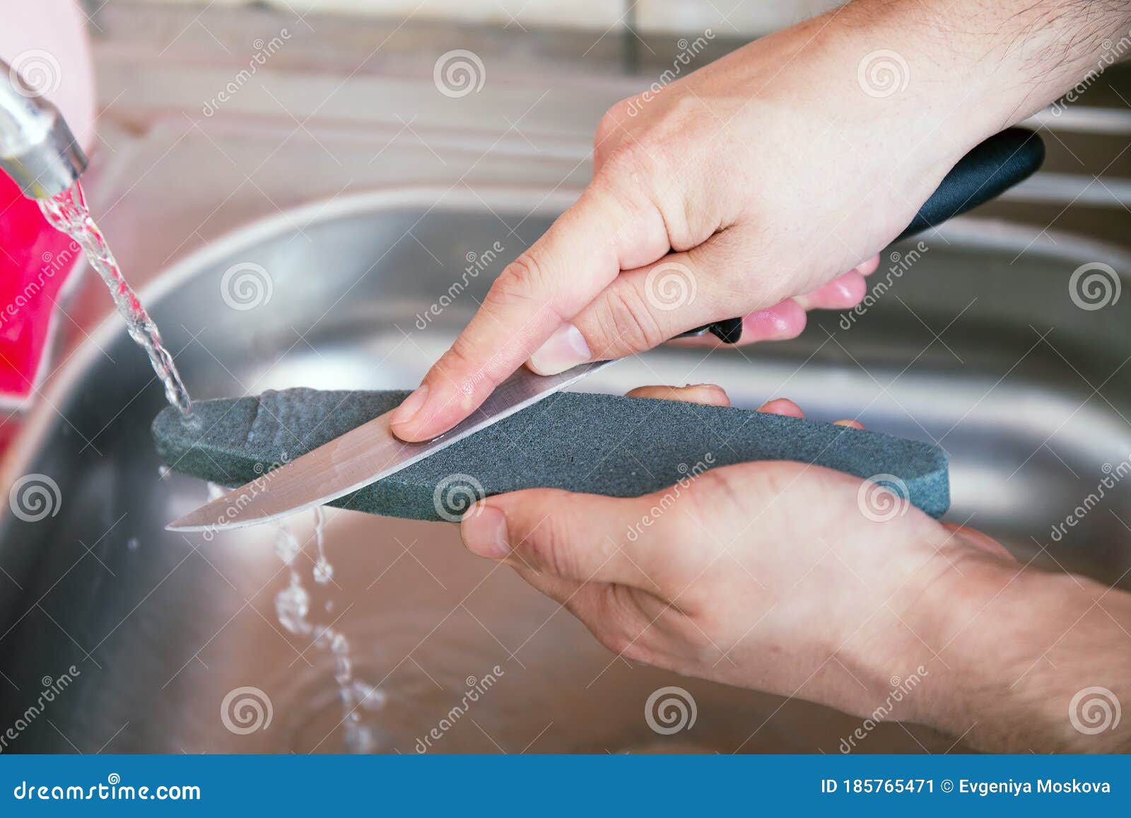 https://thumbs.dreamstime.com/z/close-up-hands-man-carefully-manual-sharpen-knife-under-stream-water-grindstone-home-household-sharpening-care-185765471.jpg