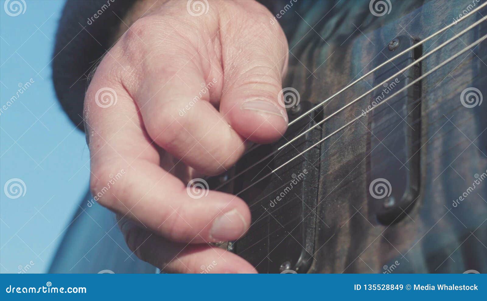 Close Up Of Hands Playing Bass Guitar Stock Male Hands Of Guitarist Playing Chords On Bass Guitar Music Performed On Stock Image Image Of Dramatic Background