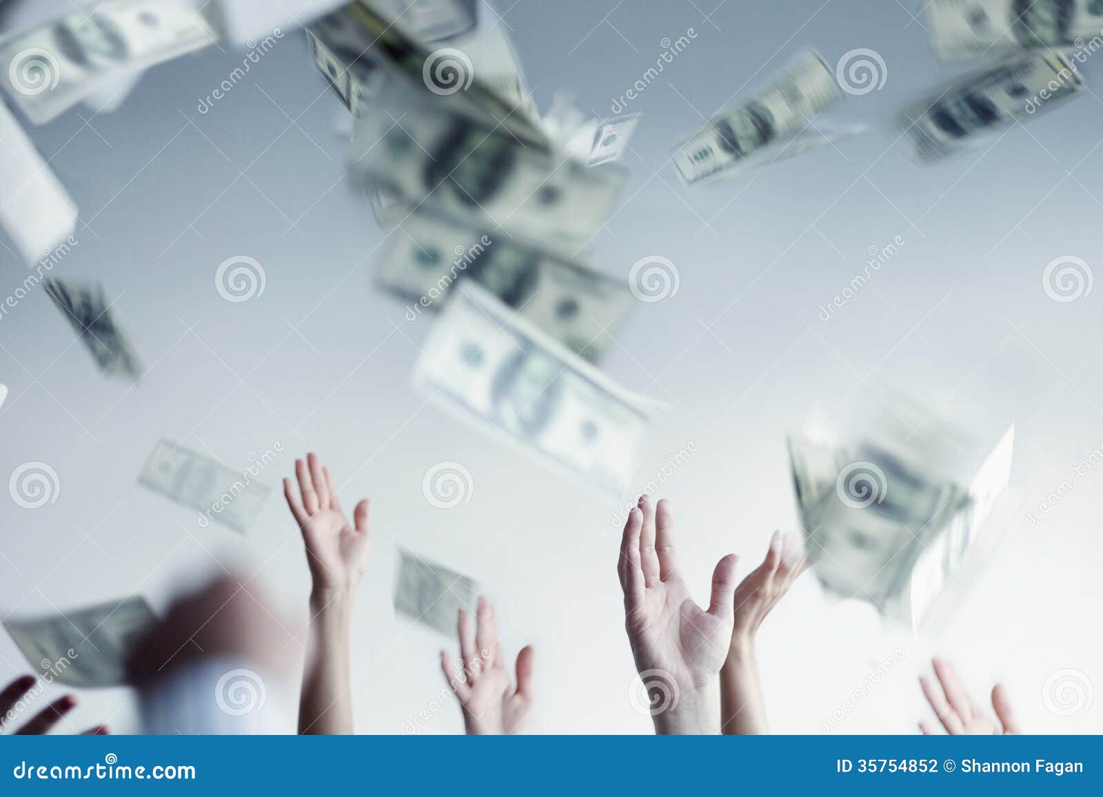 Close Up on Hands Raised Throwing and Catching Money in the Air Stock