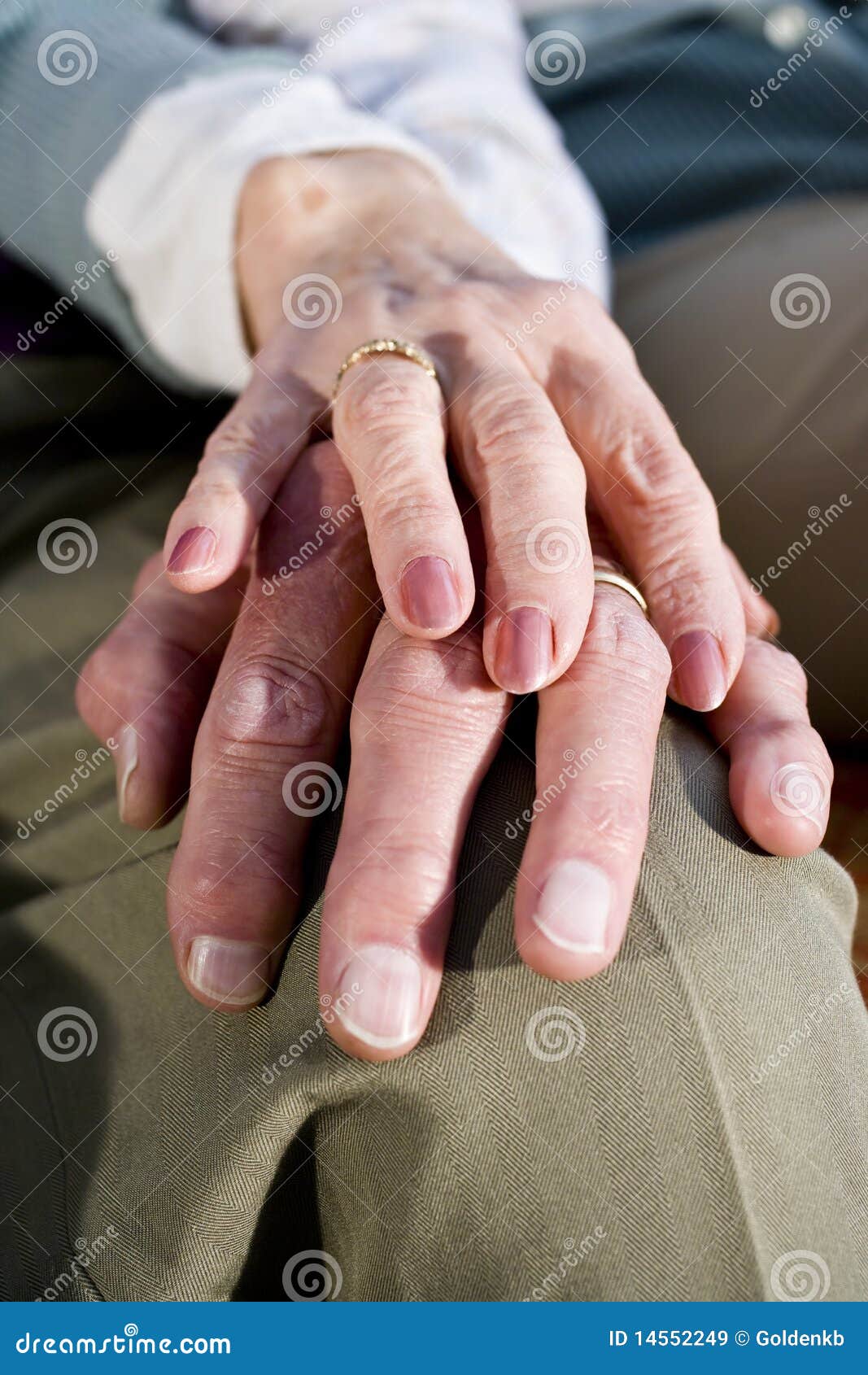 Close-up Hands Of Senior Couple Resting On Knee Royalty Free Stock